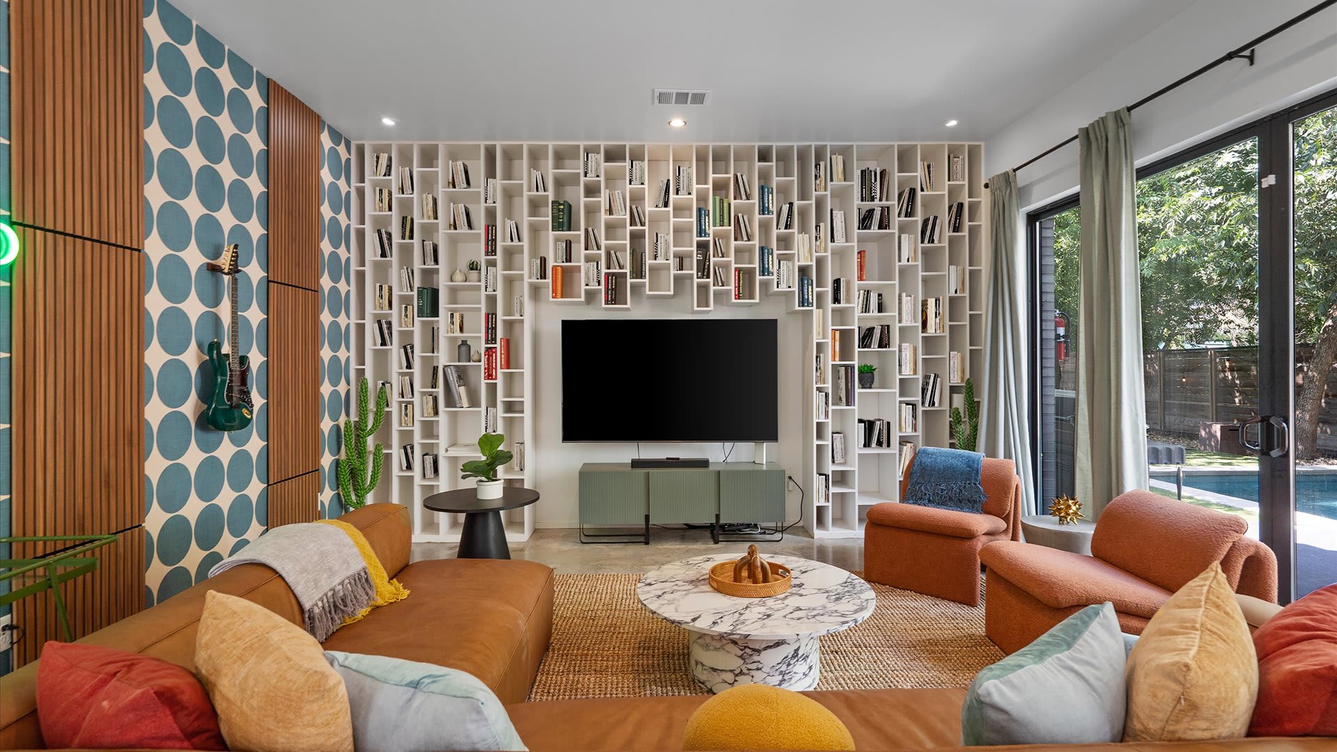 Bright & Stylish Living Area - A sun-filled living room with comfortable seating, modern décor, and large windows.