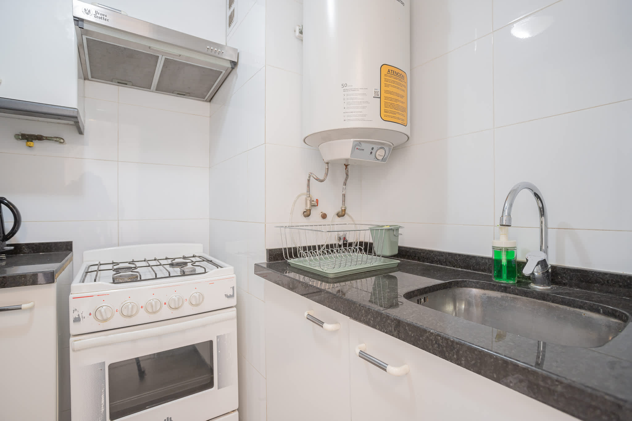 Efficient kitchen with essential amenities, perfect for preparing meals during your stay in Chile.