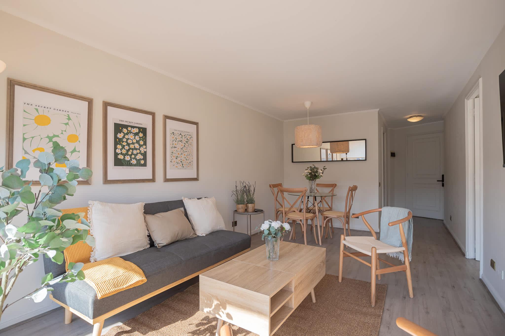 Enjoy a bright, modern living area with stylish decor and a cozy dining space, perfect for relaxation after exploring the city.
