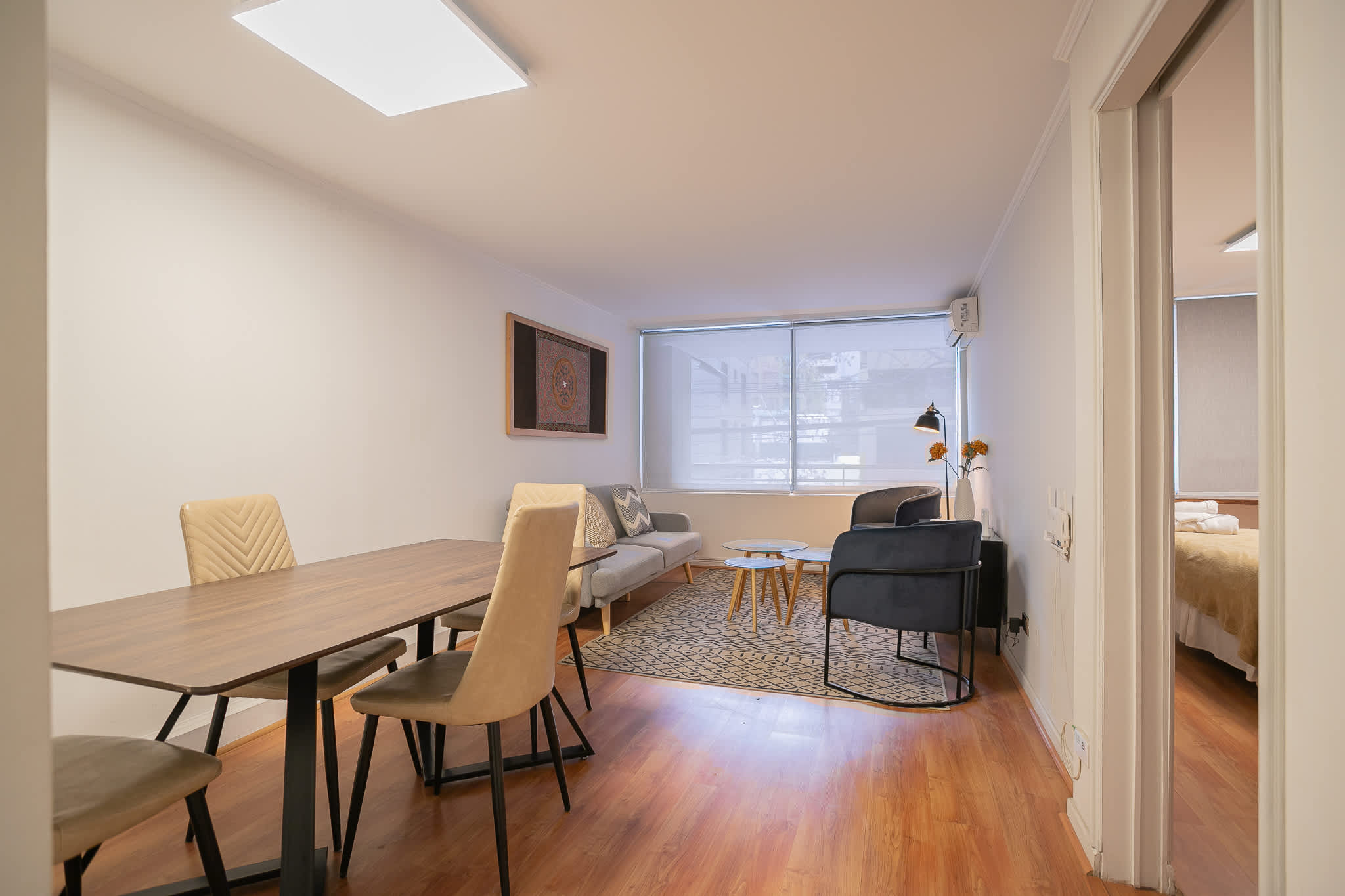 Bright and inviting living area with stylish seating and a cozy atmosphere, perfect for unwinding after city adventures.