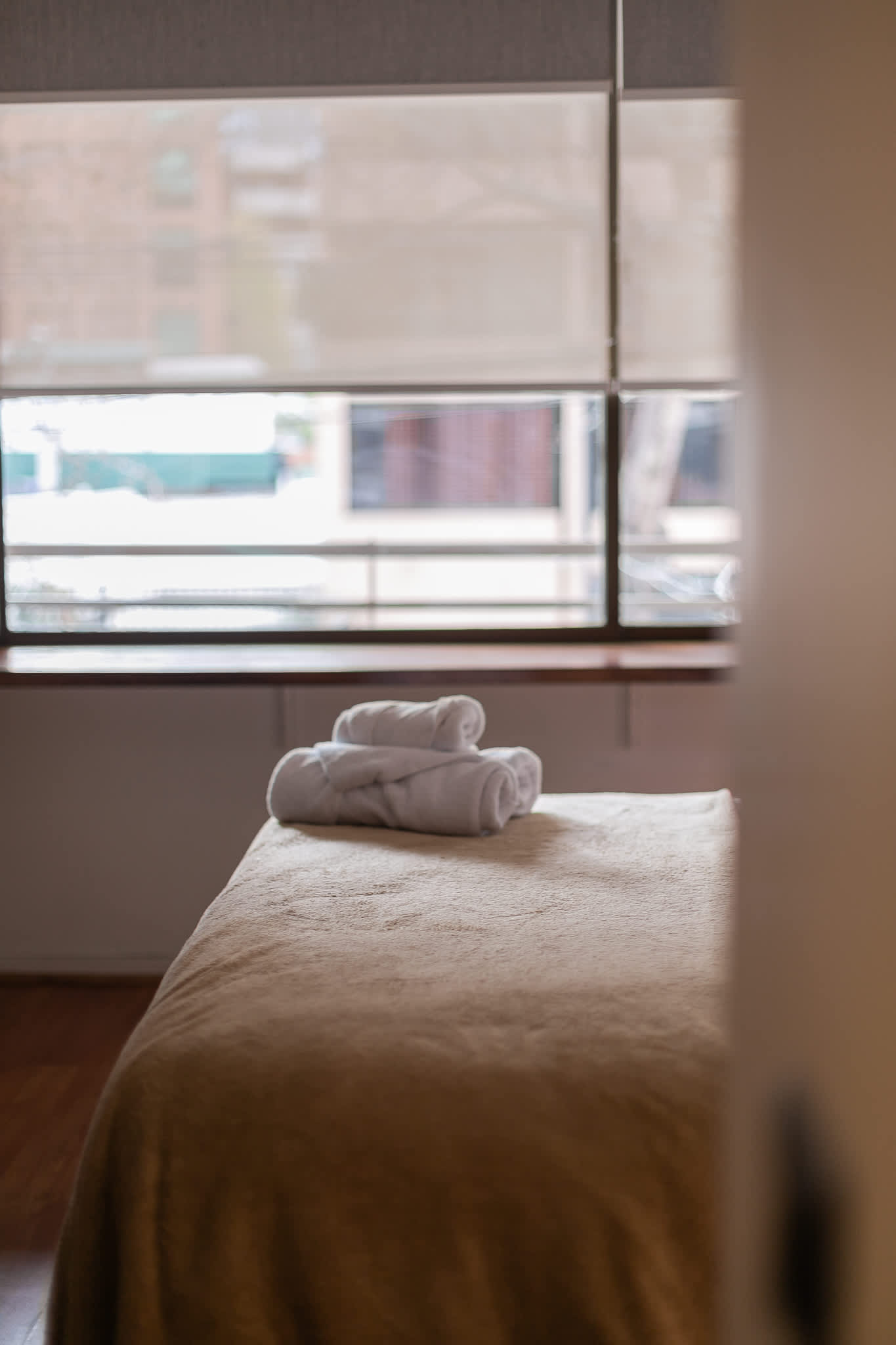 Relax in this cozy bedroom with soft linens and abundant natural light, perfect for unwinding after a day of exploring.