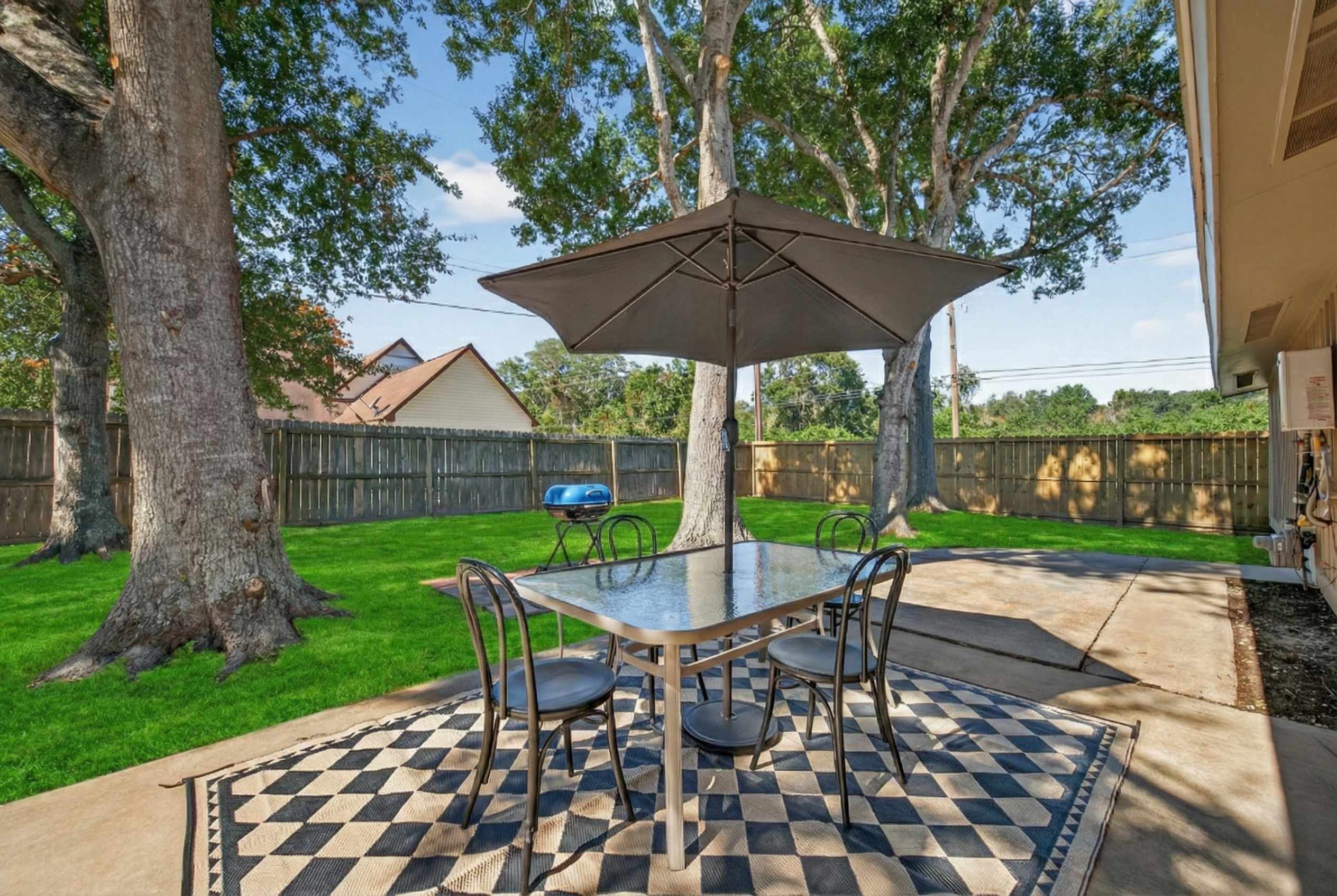 Modern 4BR Retreat w/ Private Backyard & BBQ