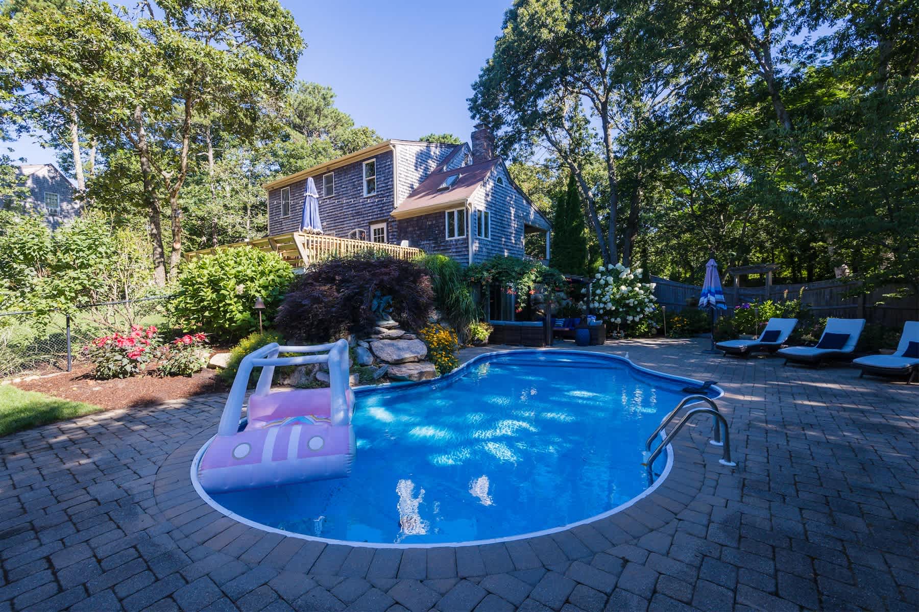 Beautiful Eastham home featuring lush gardens with heated in ground pool 2