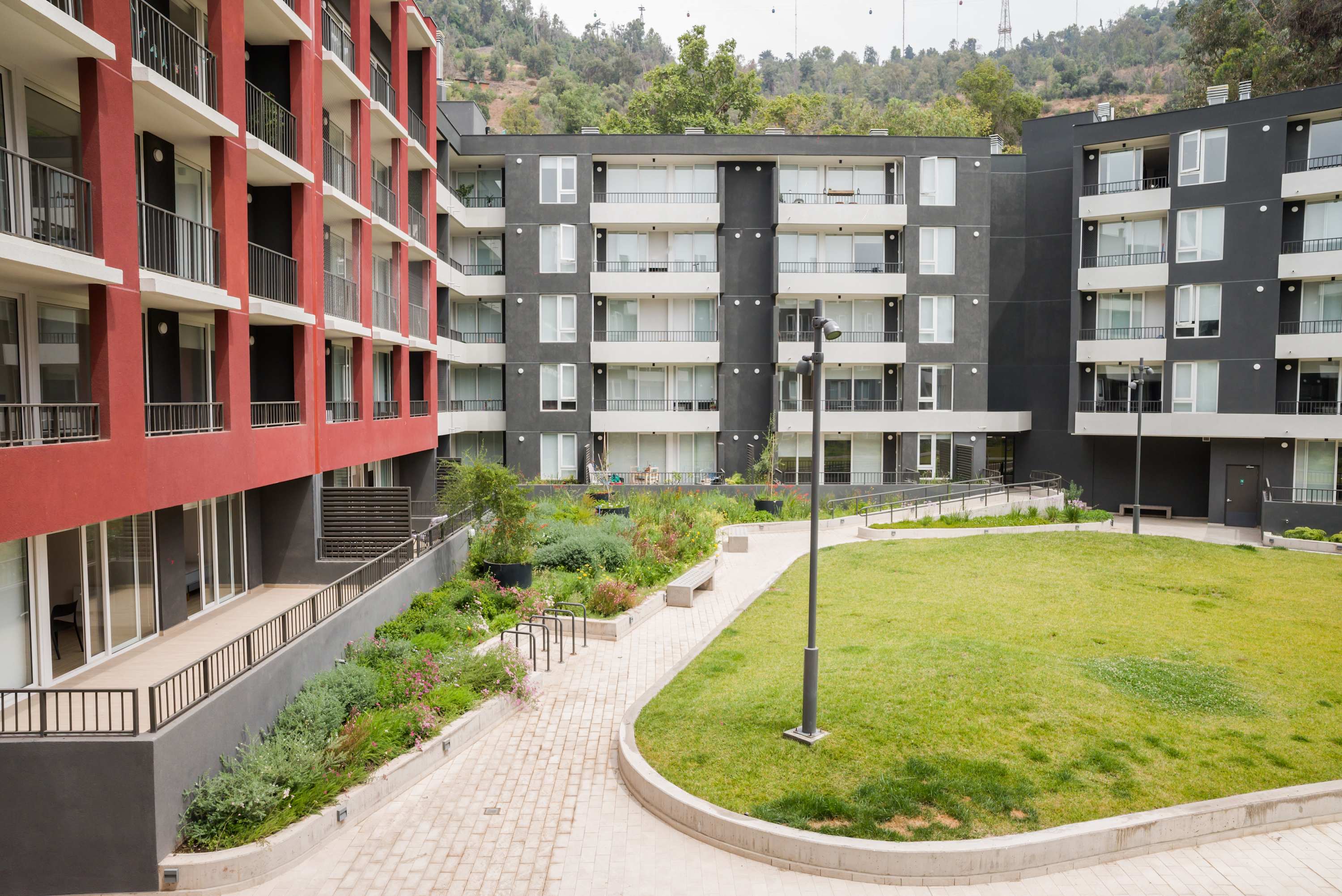 Enjoy the serene courtyard views in this modern apartment complex, perfect for relaxation and outdoor enjoyment. (Common Area)