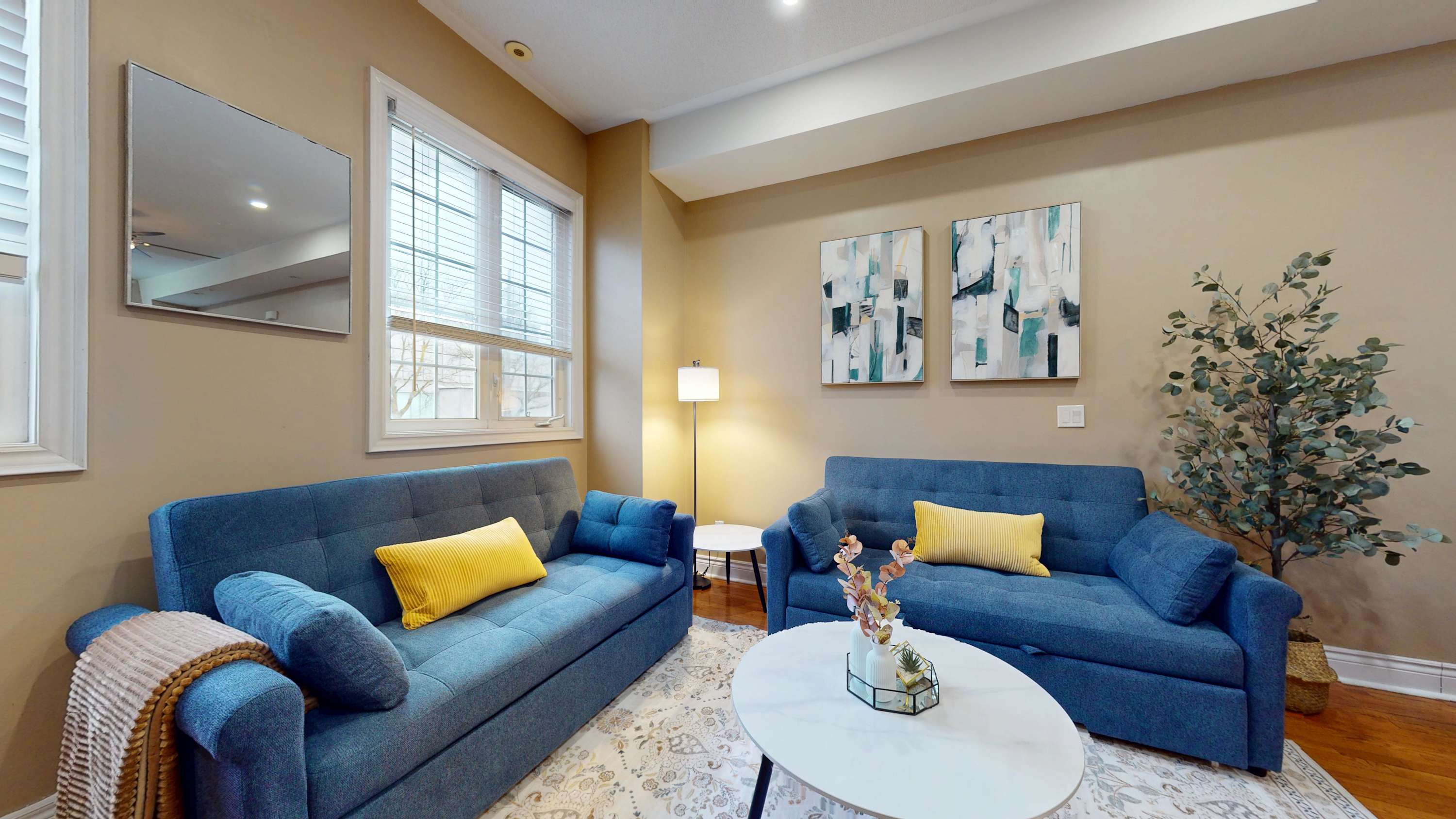 The living area features a cosy sofa bed, perfect for additional guests or lounging after a long day exploring the city.