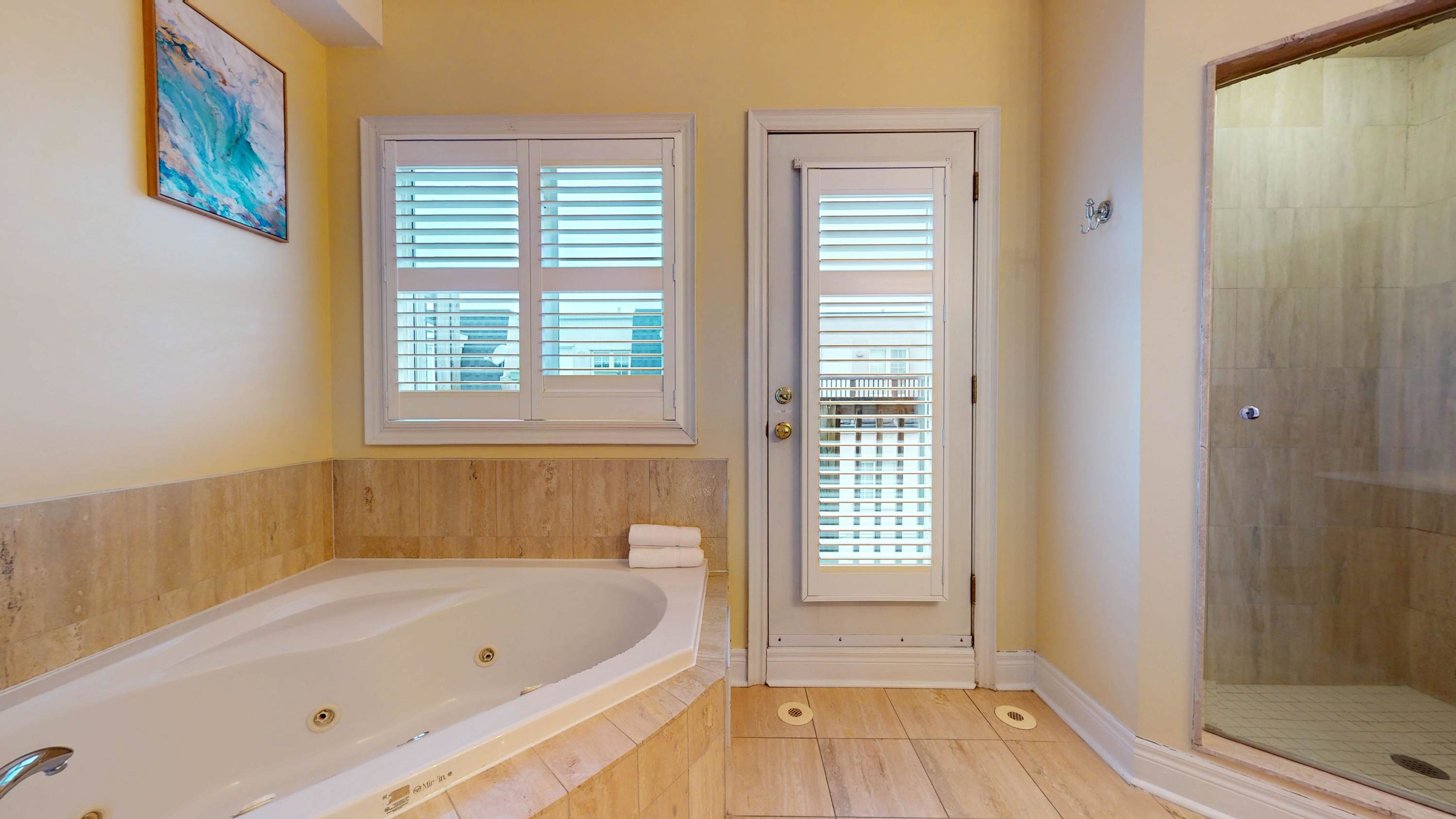 Ensuite Full Bathroom - Enjoy the convenience of a private ensuite with a full bath, shower/tub combination, and fresh towels.
