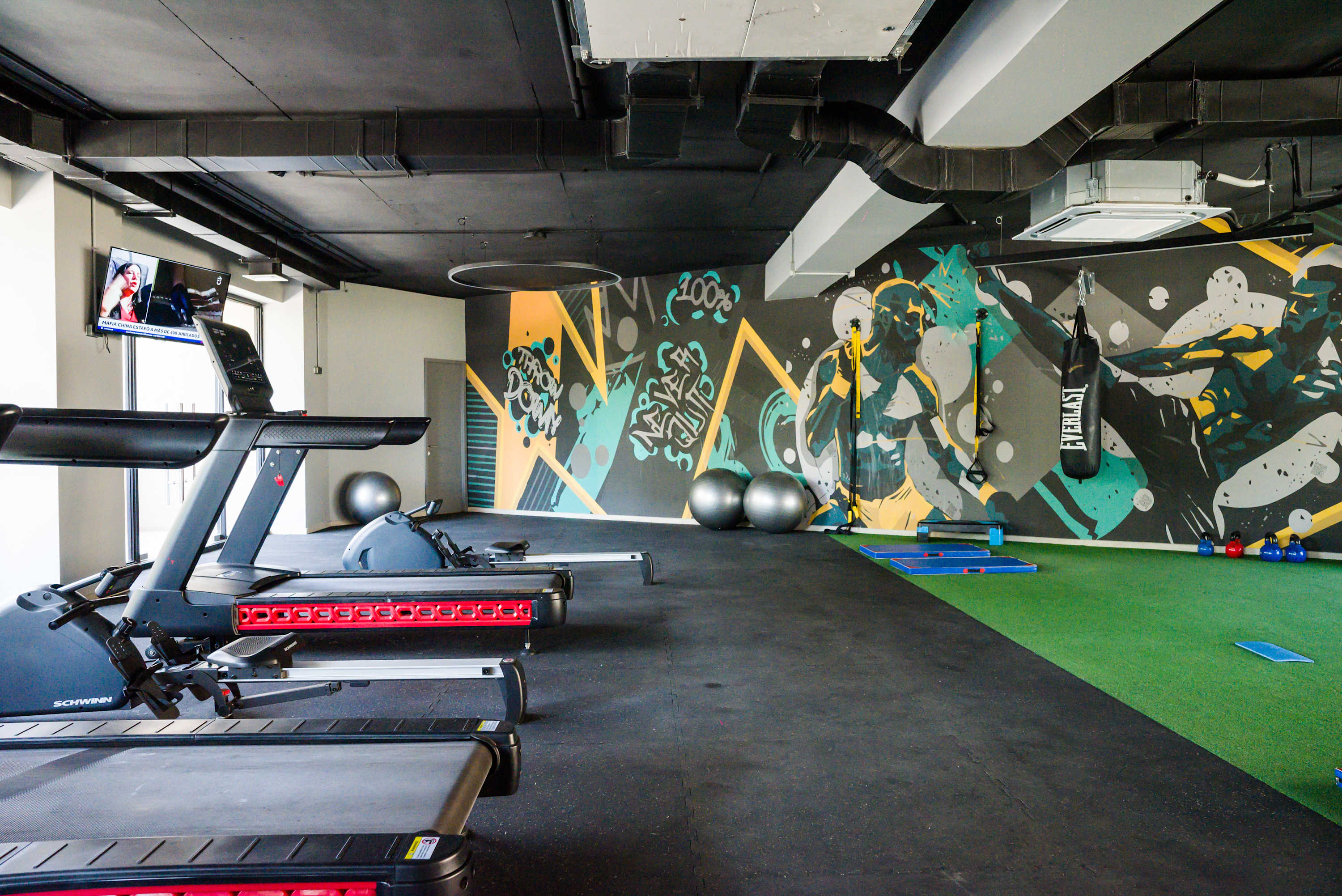 Work out in style in this vibrant gym with top-notch equipment and inspiring art. (Common Area)