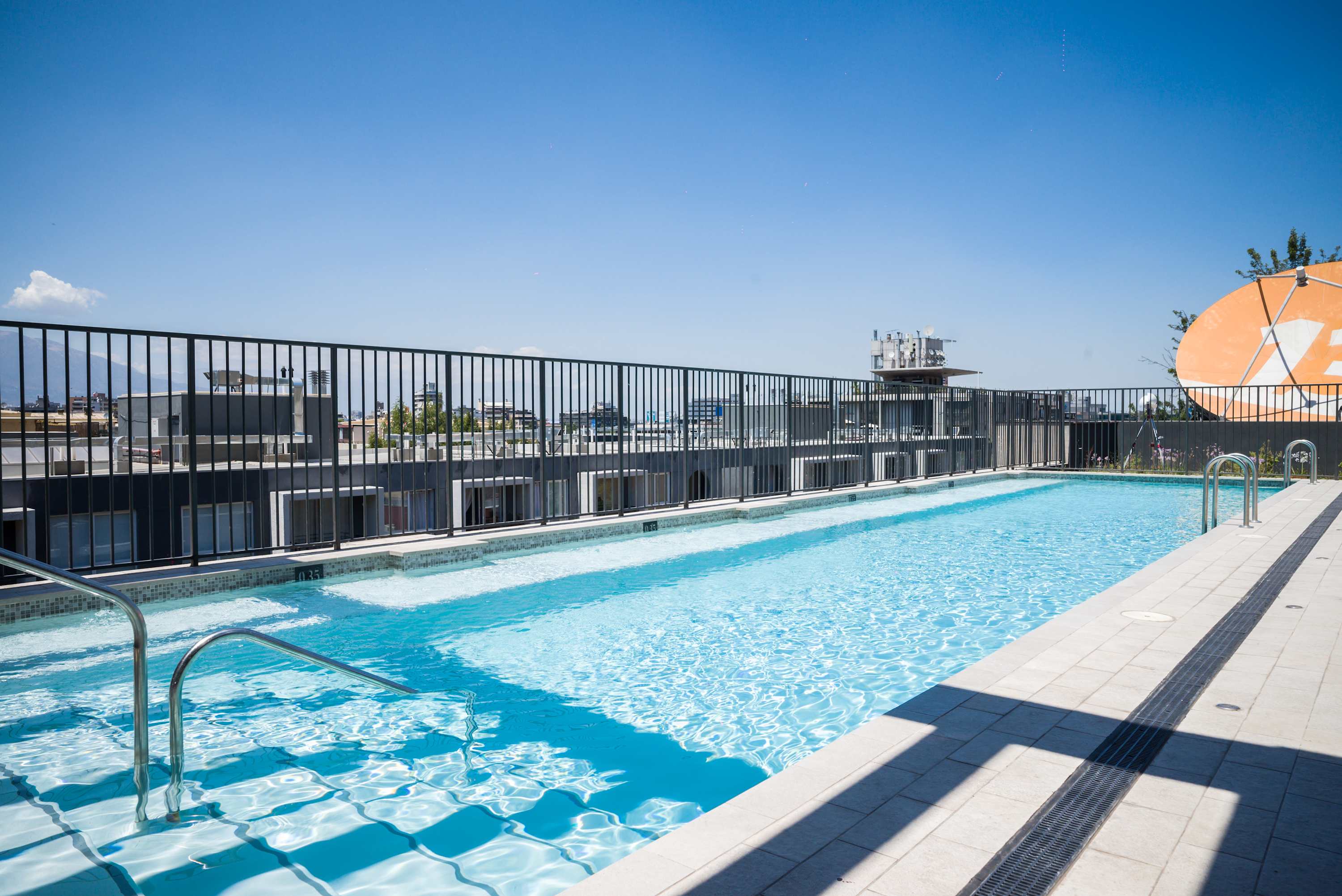 Dive into relaxation with stunning rooftop views of the city and mountains. Enjoy a refreshing swim in the rooftop pool with stunning city and mountain views. (Common Area)