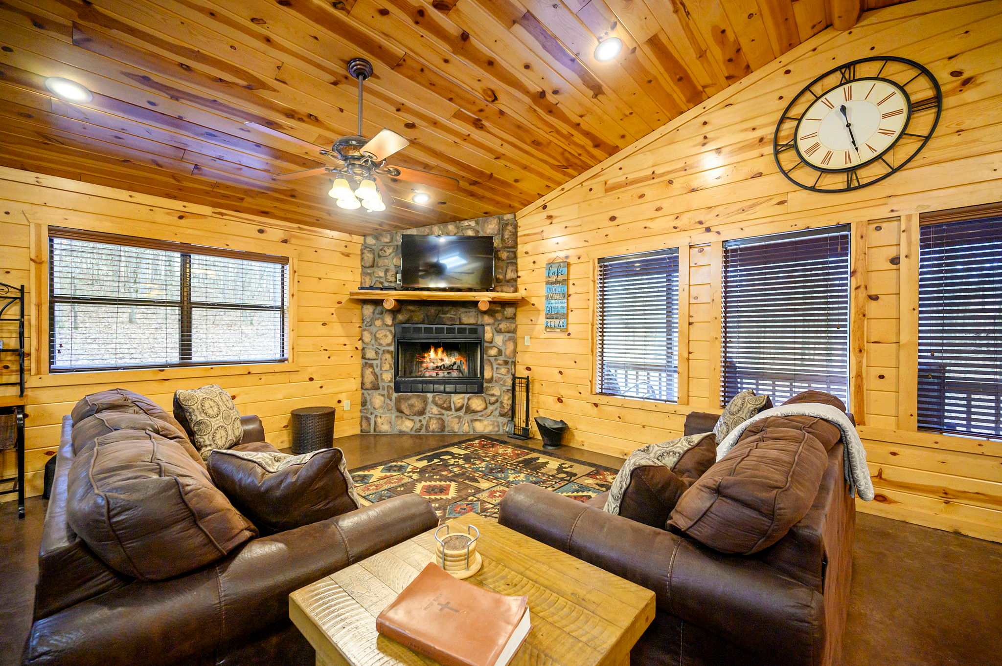 Open living room with smart TV, fireplace, pool table, sleeper sofa, and futon