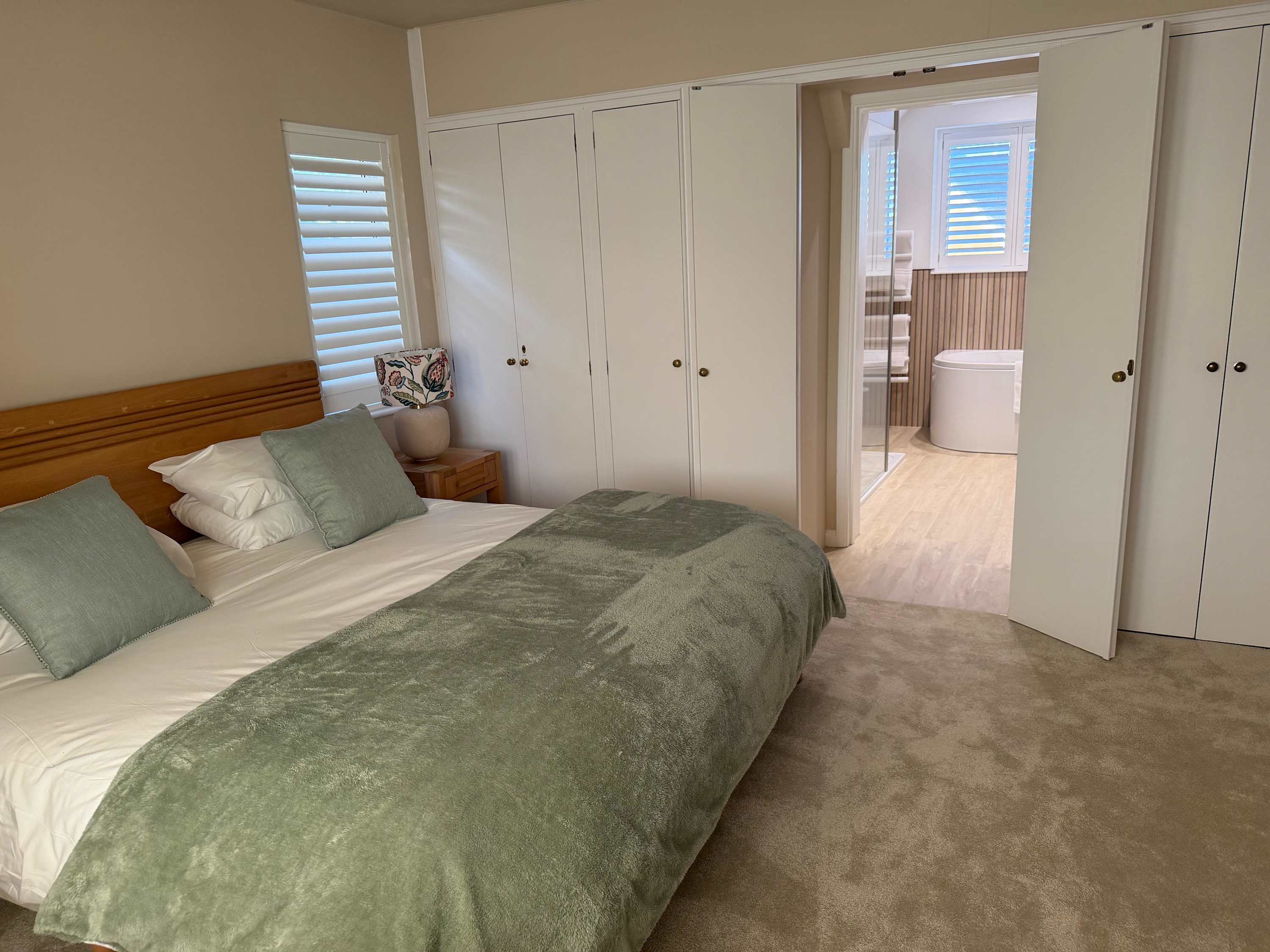 The master bedroom with en-suite. A perfect place to rest following a day on the coast