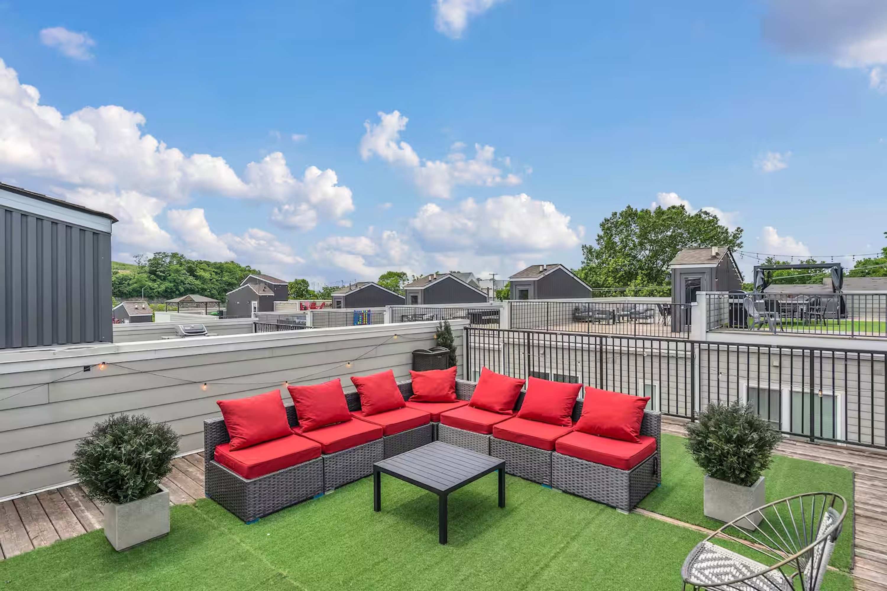 Rooftop patio with grill, corn hole, and views perfect for lounging.