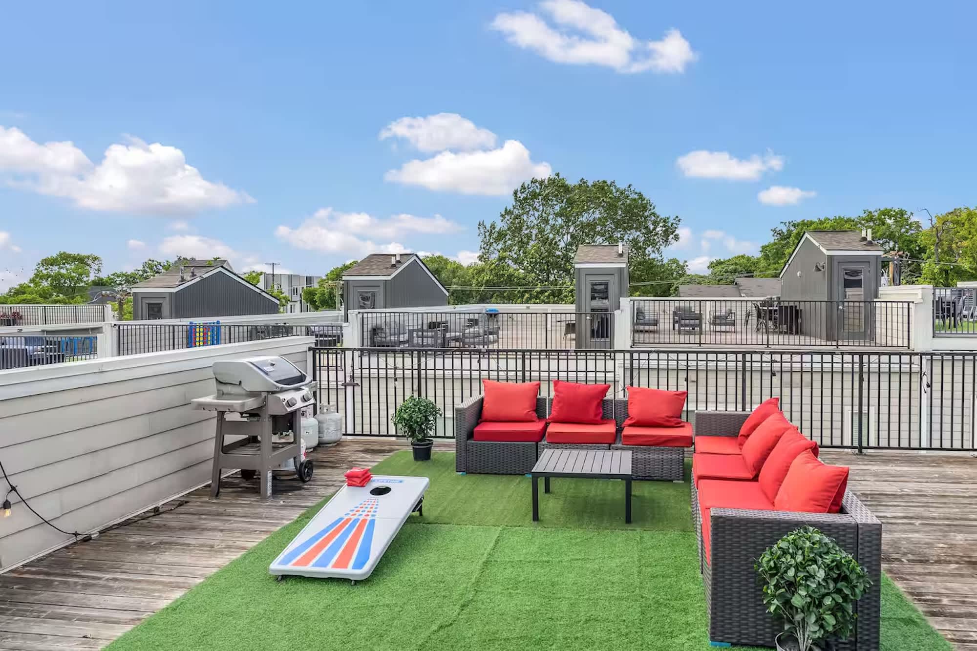 Rooftop patio with grill, corn hole, and views perfect for lounging | Unit A