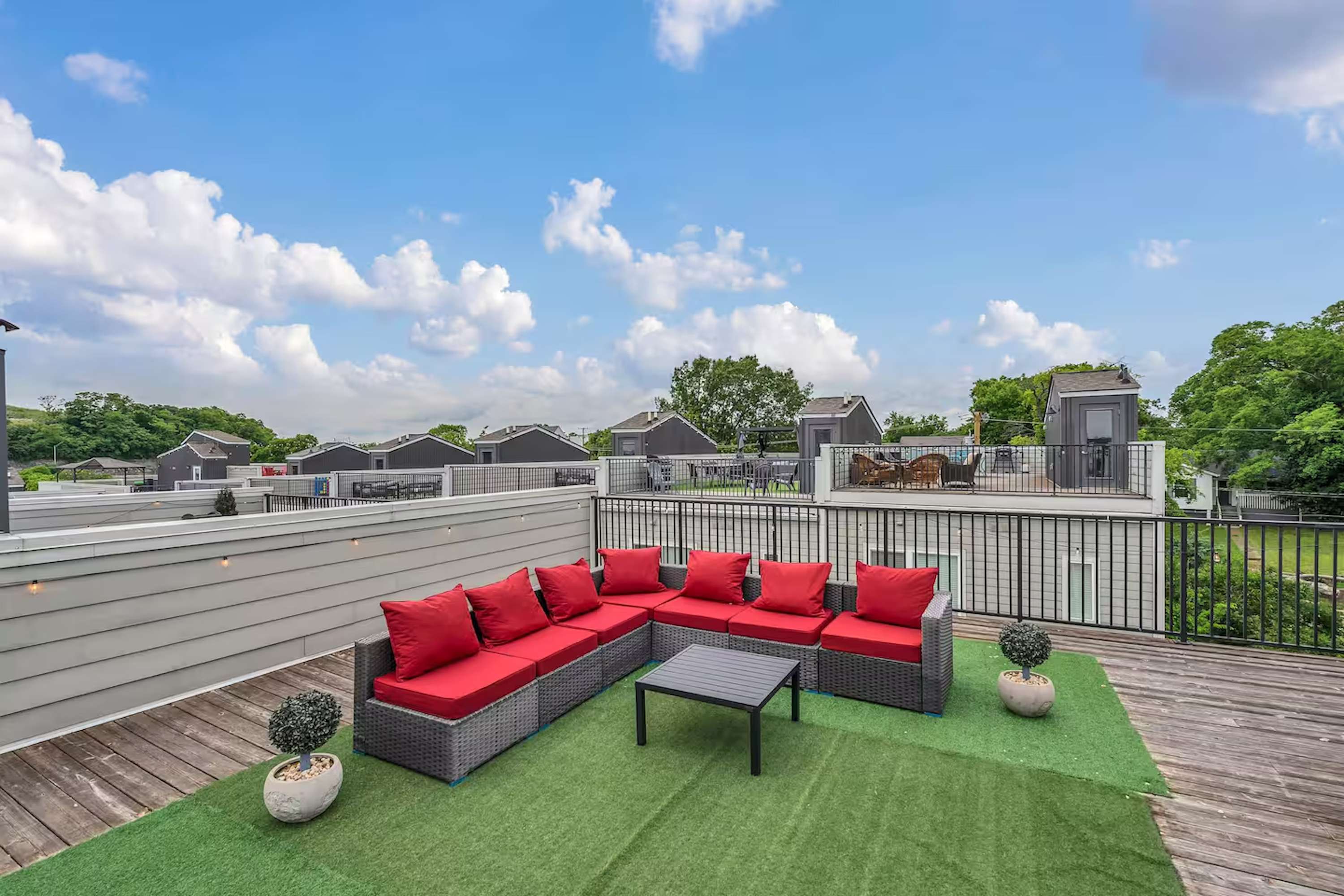 Rooftop patio with grill, corn hole, and views perfect for lounging above each unit