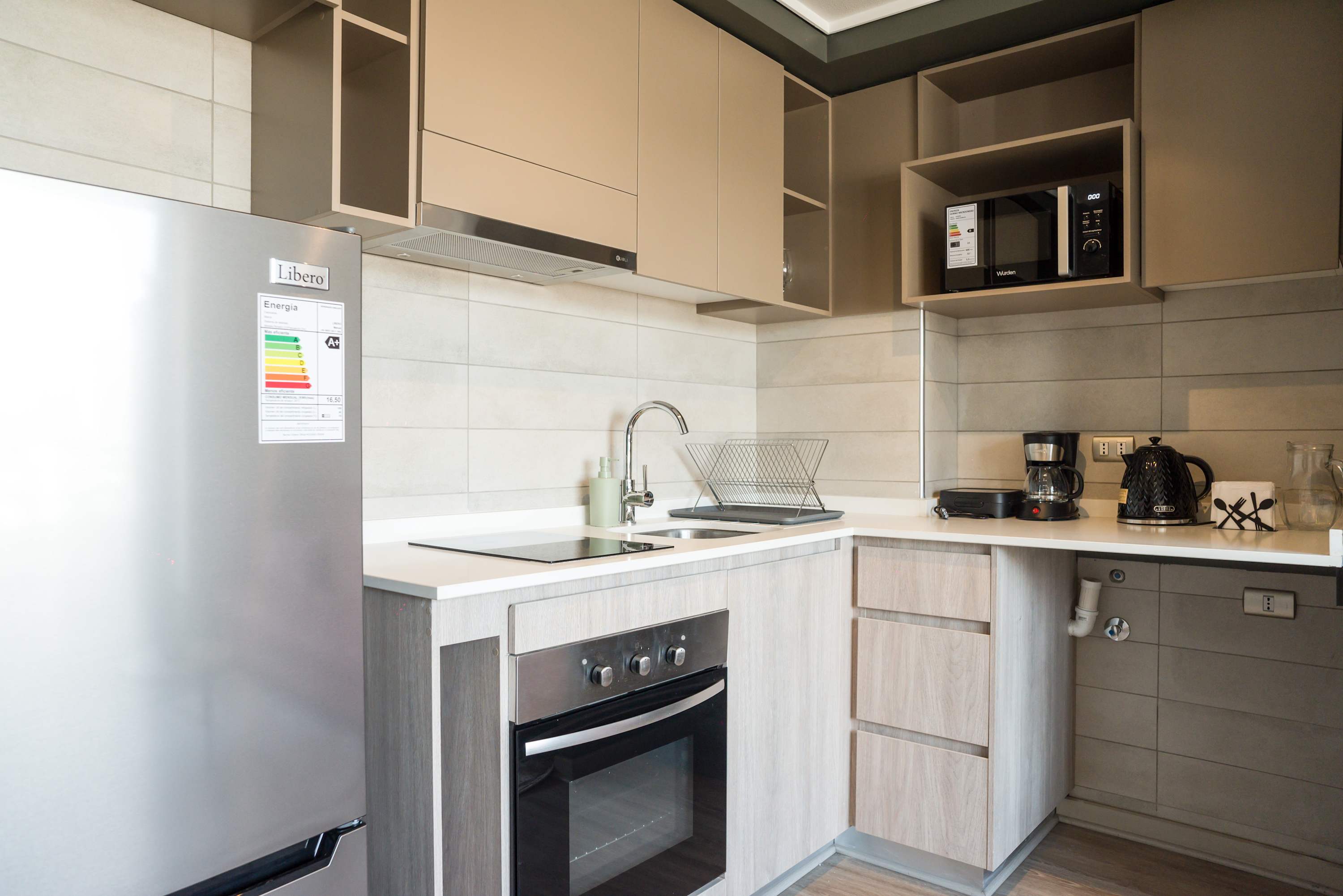 Modern kitchen with sleek appliances and ample counter space, perfect for cooking your favorite meals.