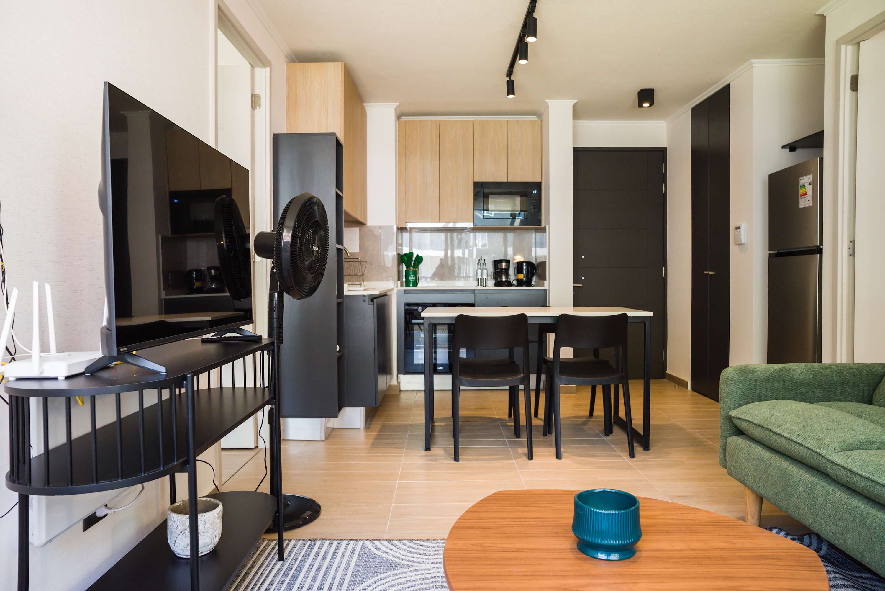 Cozy and modern living space with a sleek kitchen, perfect for relaxing after exploring the city.