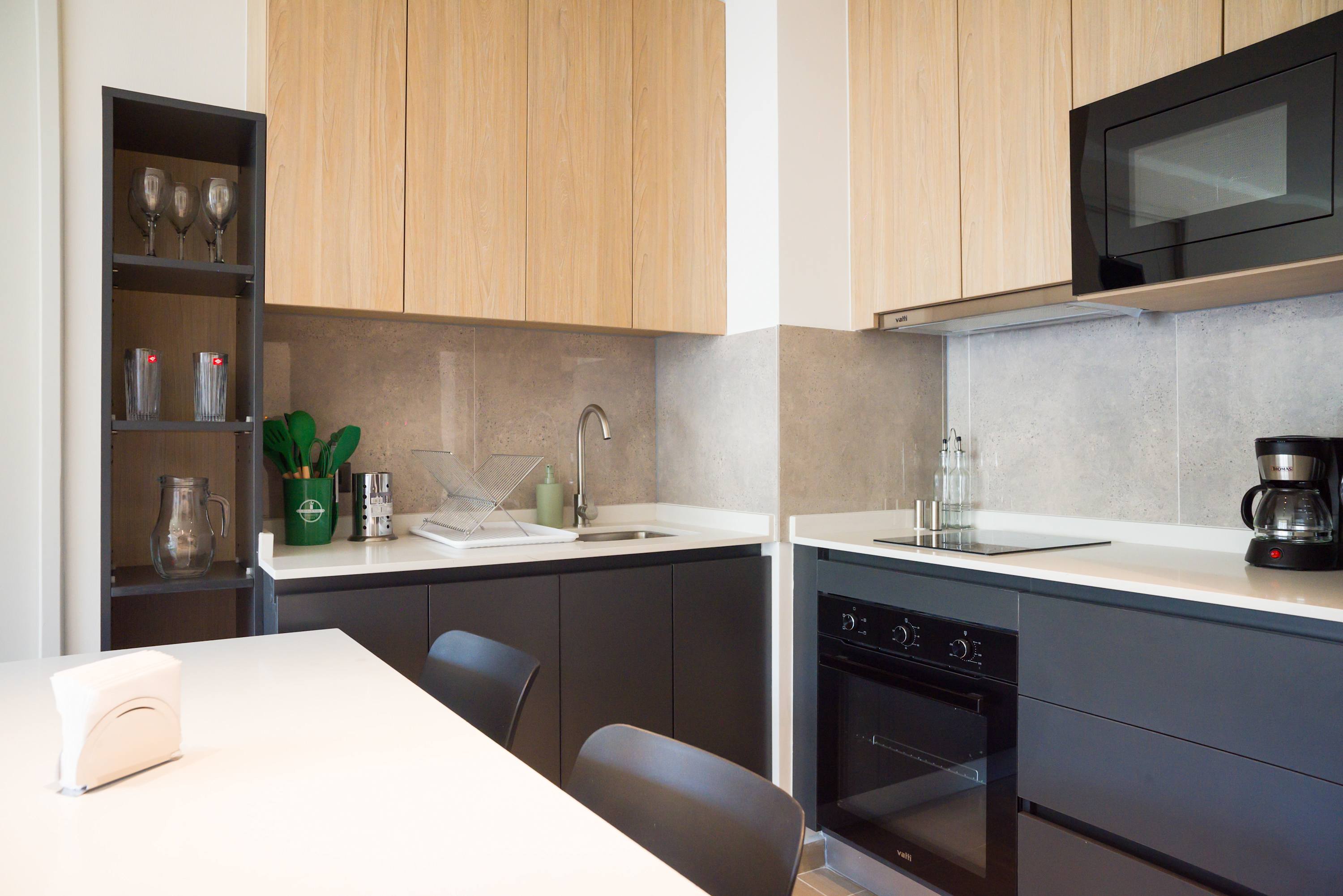 Sleek and modern kitchen with all essentials for a comfortable stay.
