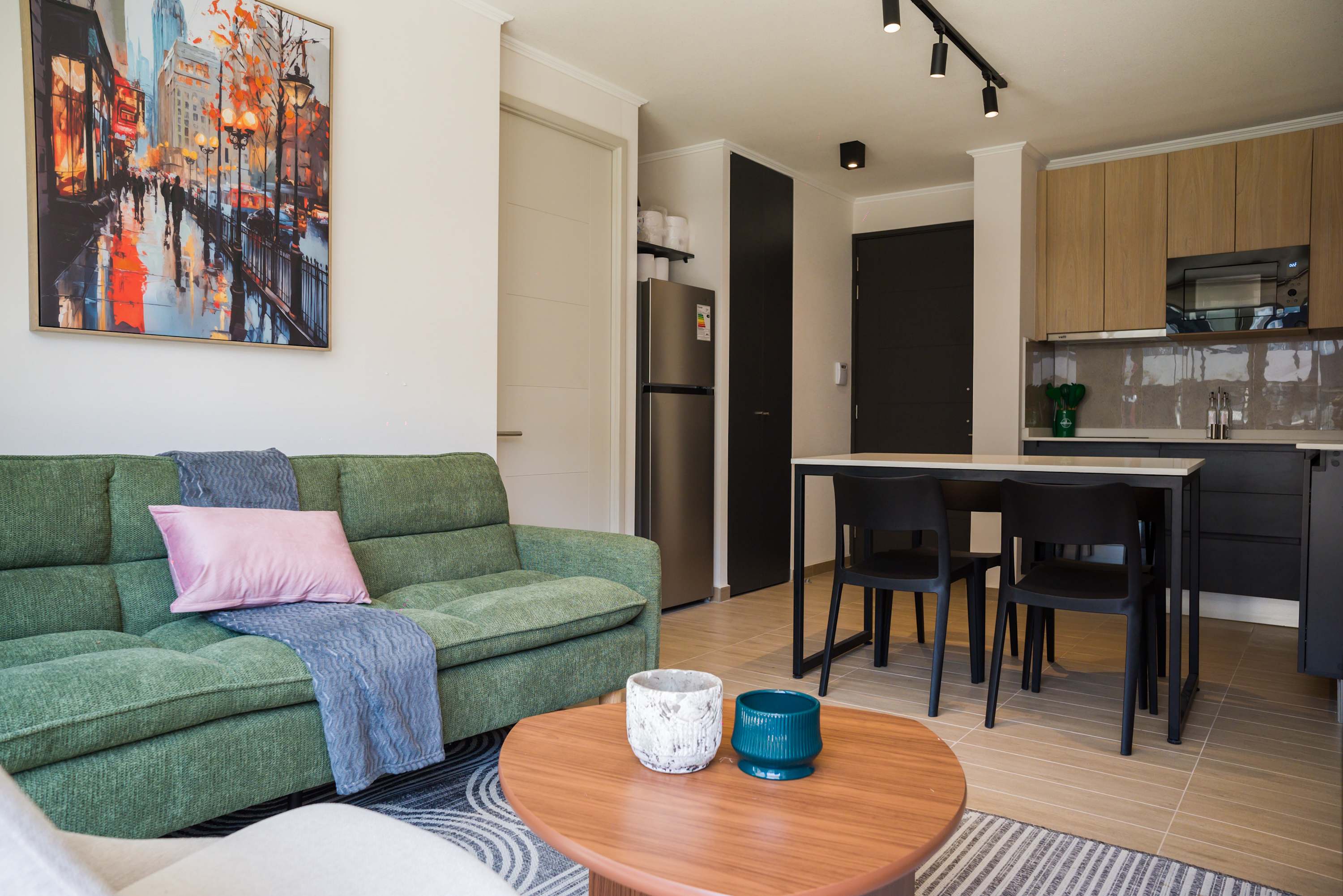 Cozy and stylish living area with modern amenities and vibrant decor, perfect for relaxation and dining.