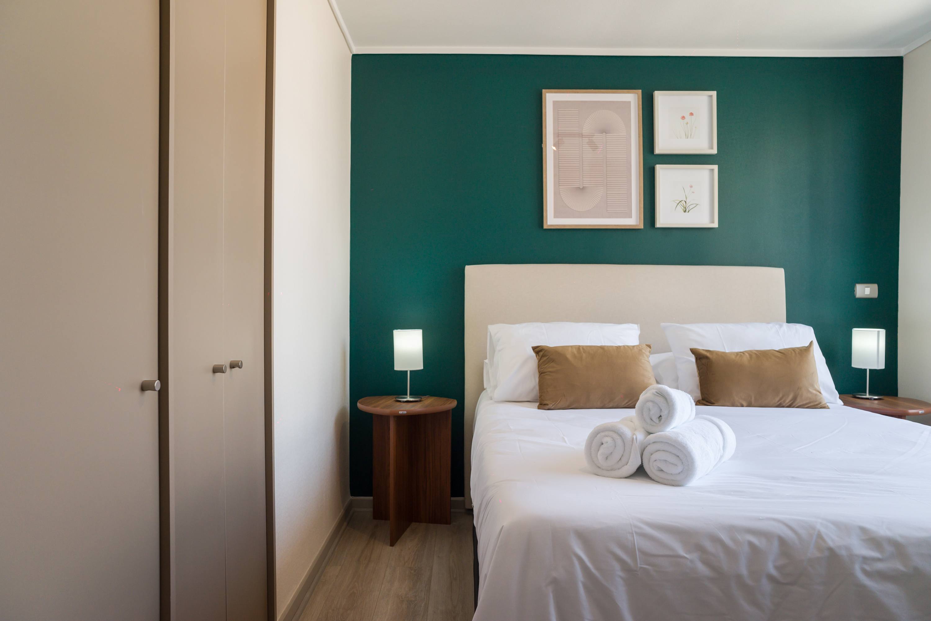 Relax in this cozy bedroom with stylish decor and a comfortable bed, perfect for unwinding after a day of exploring.
