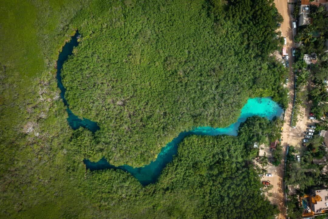 Enjoy a stunning drone view from Casa cenote or Cenote Manatie ideal for diving and snorkeling. One of Tulum’s most beautiful cenotes, uniquely known for its rare blend of fres