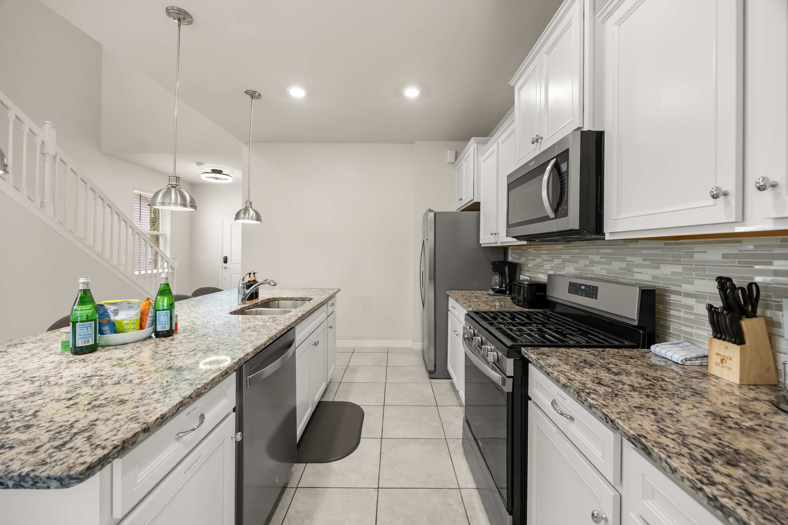 Whip up meals with ease in the fully equipped kitchen, complete with stainless steel appliances, granite countertops, and all cookware and dinnerware essentials.