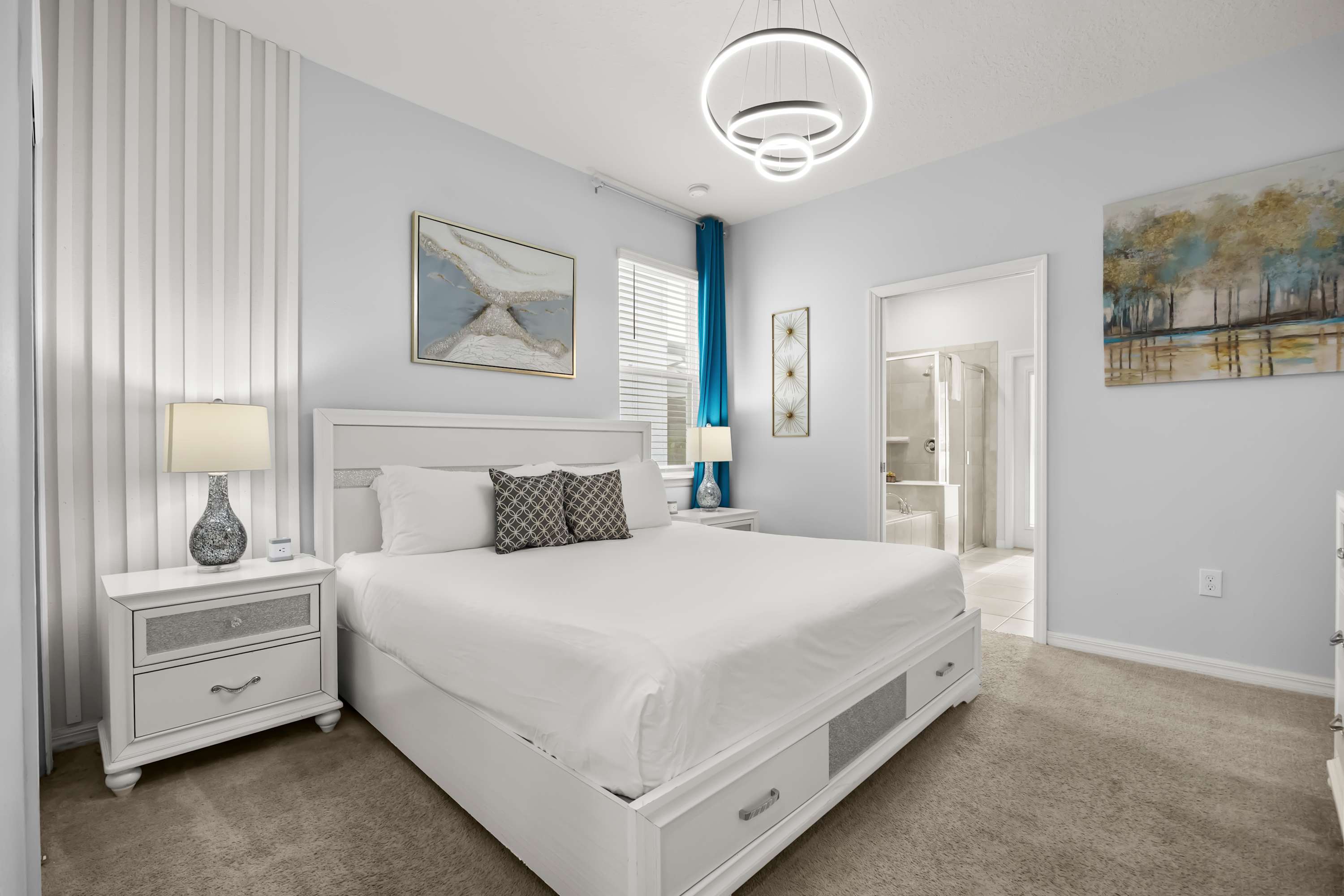 Elegant master suite with plush bedding & calming décor