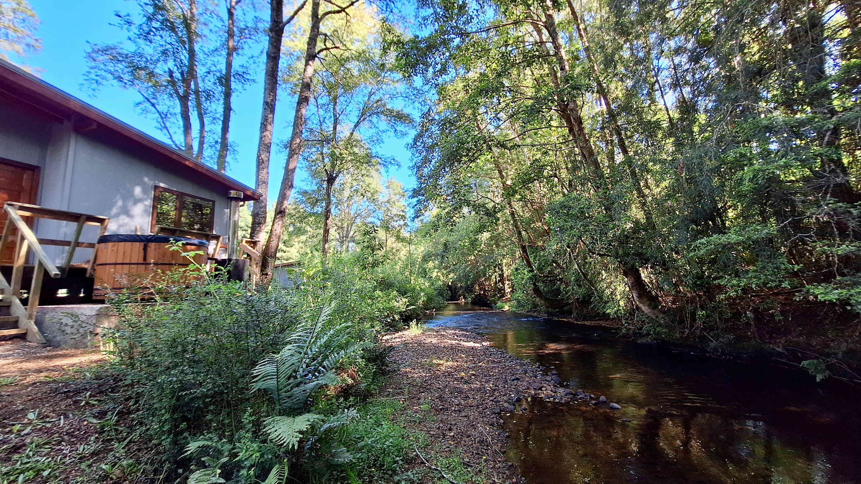 Charming Riverside Cabin w/ Hot Tub & BBQ