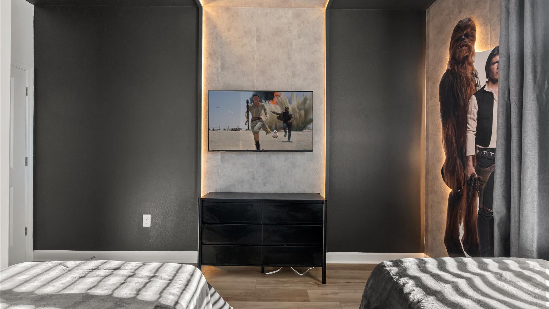 Spacious and thoughtfully styled twin bedroom for comfort with a smart TV