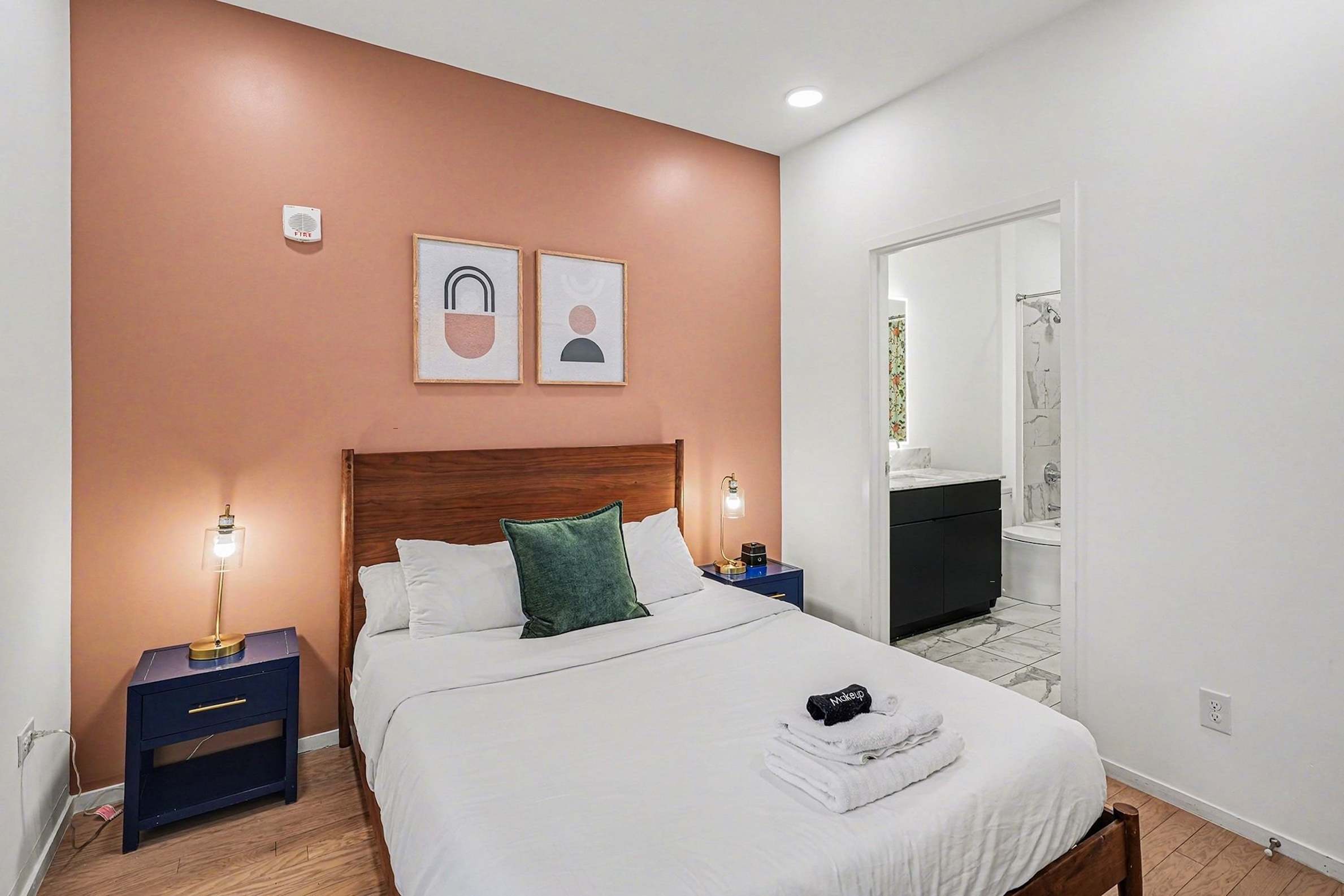 The primary suite boasts a plush queen bed & private ensuite bath