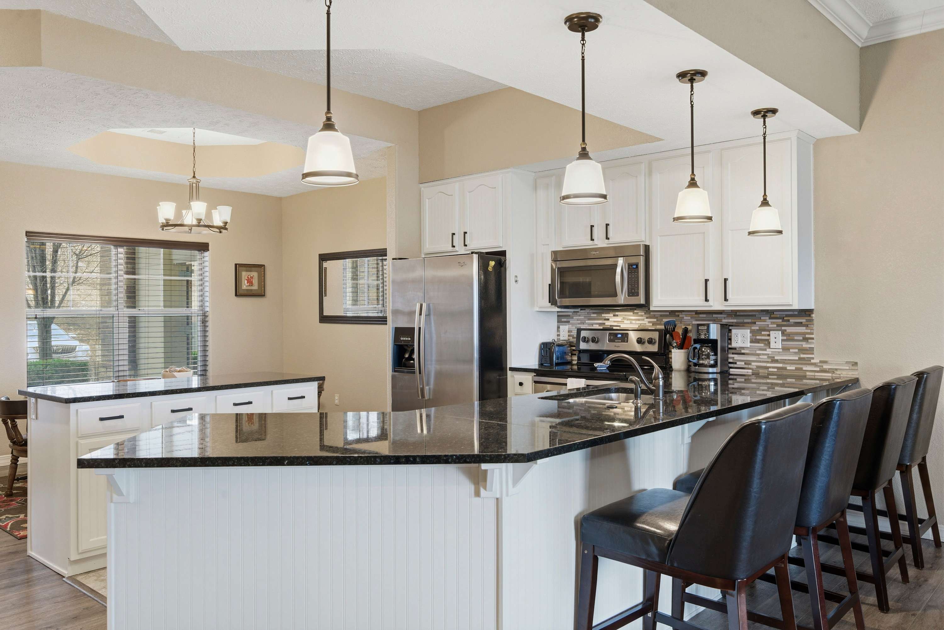 The chic, open kitchen is well equipped for an unforgettable getaway​