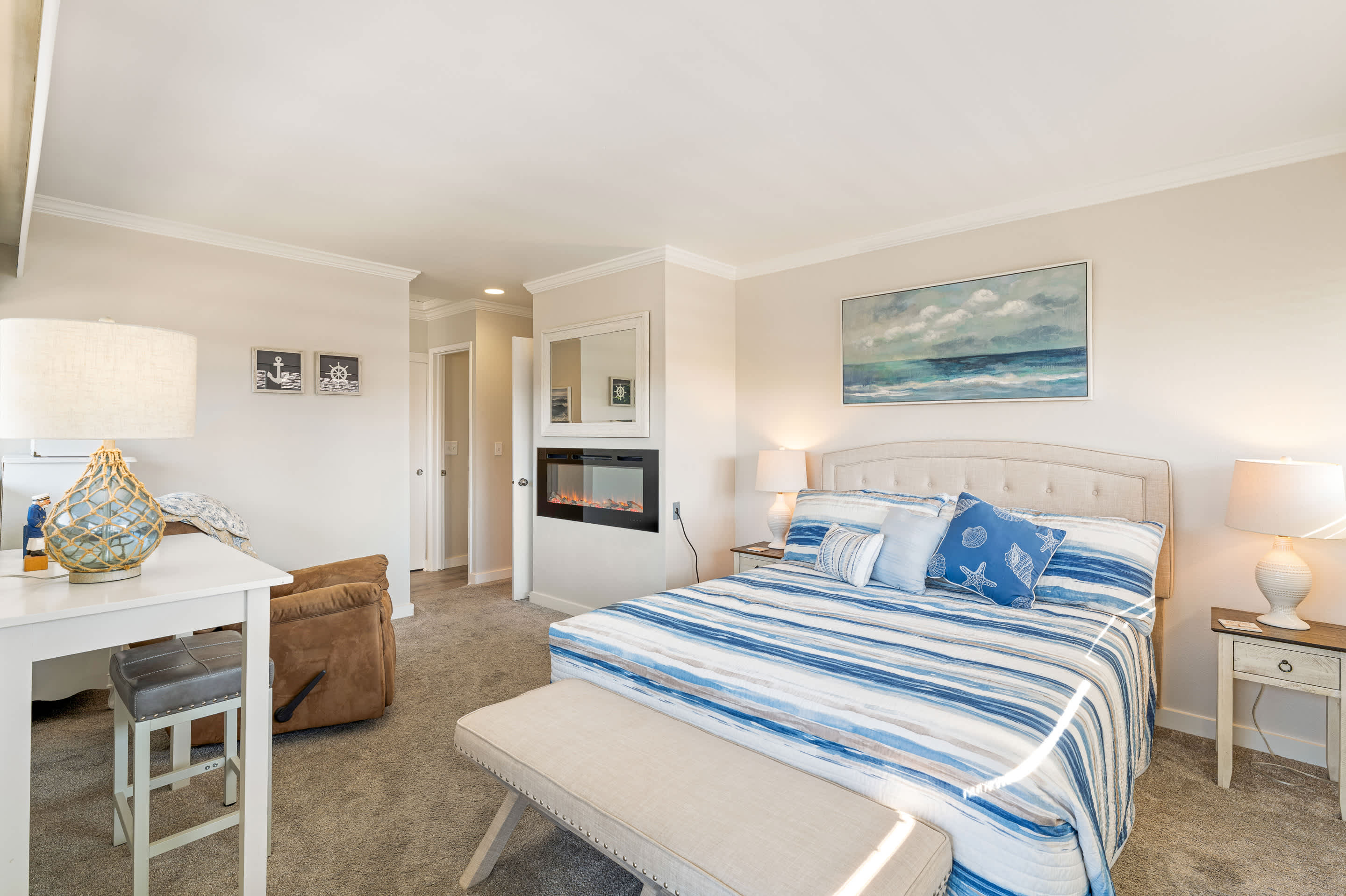 Bedroom 1 with queen bed, balcony, and ensuite. 