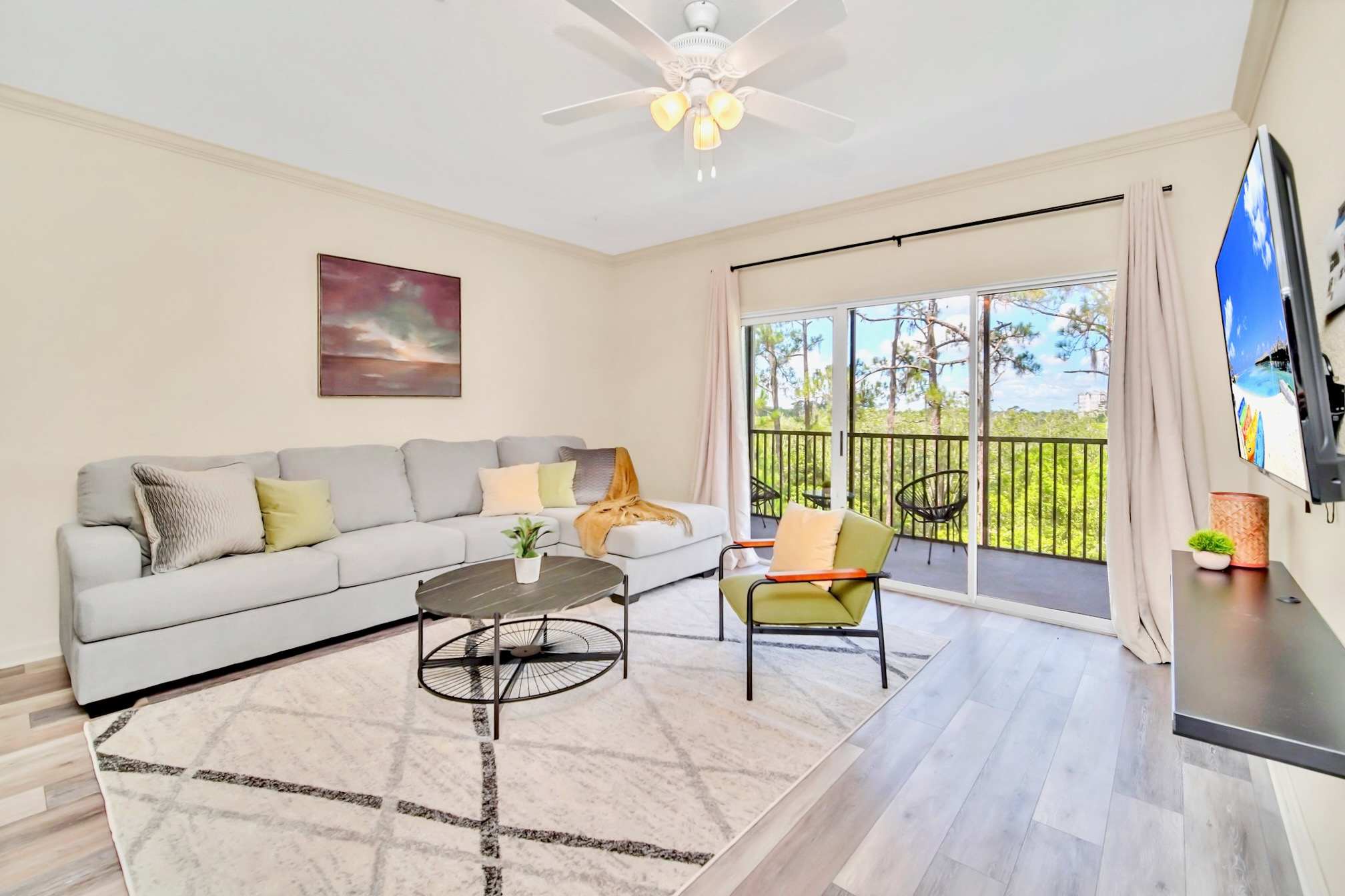 Living room with smart TV and direct patio access