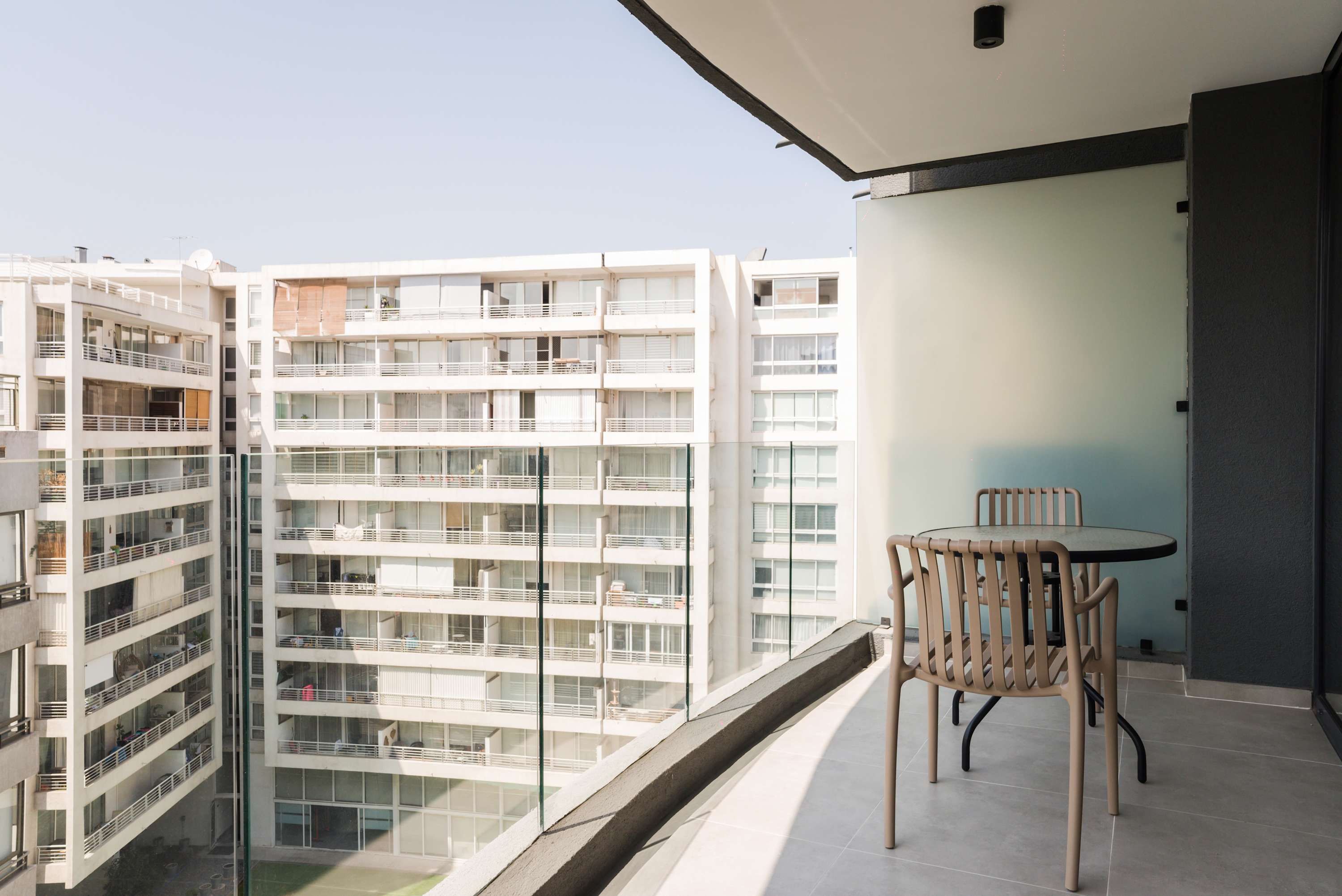 Enjoy your morning coffee on a private balcony with city views, perfect for relaxing and unwinding.