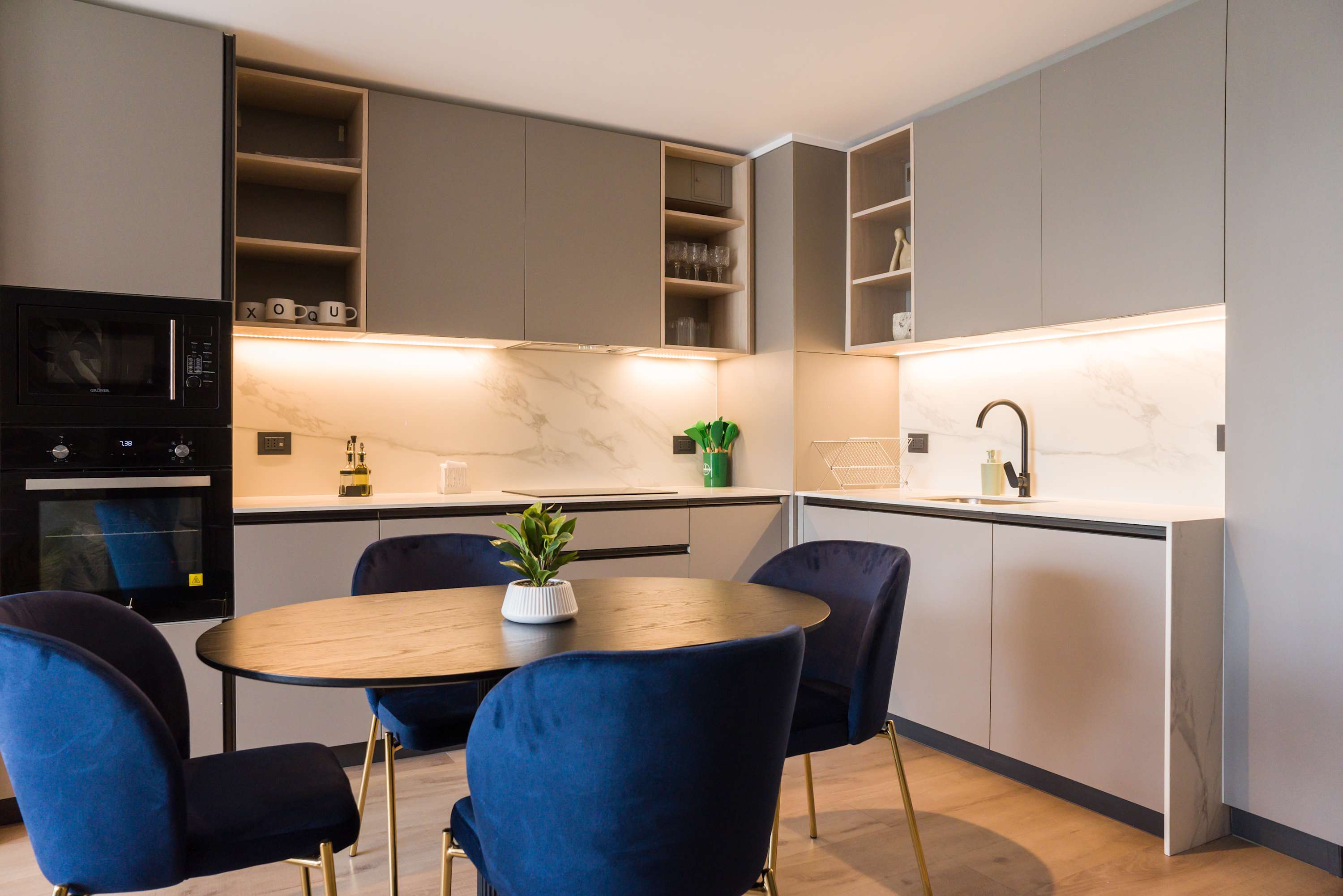 Stylish kitchen with modern amenities and cozy dining area perfect for family meals.