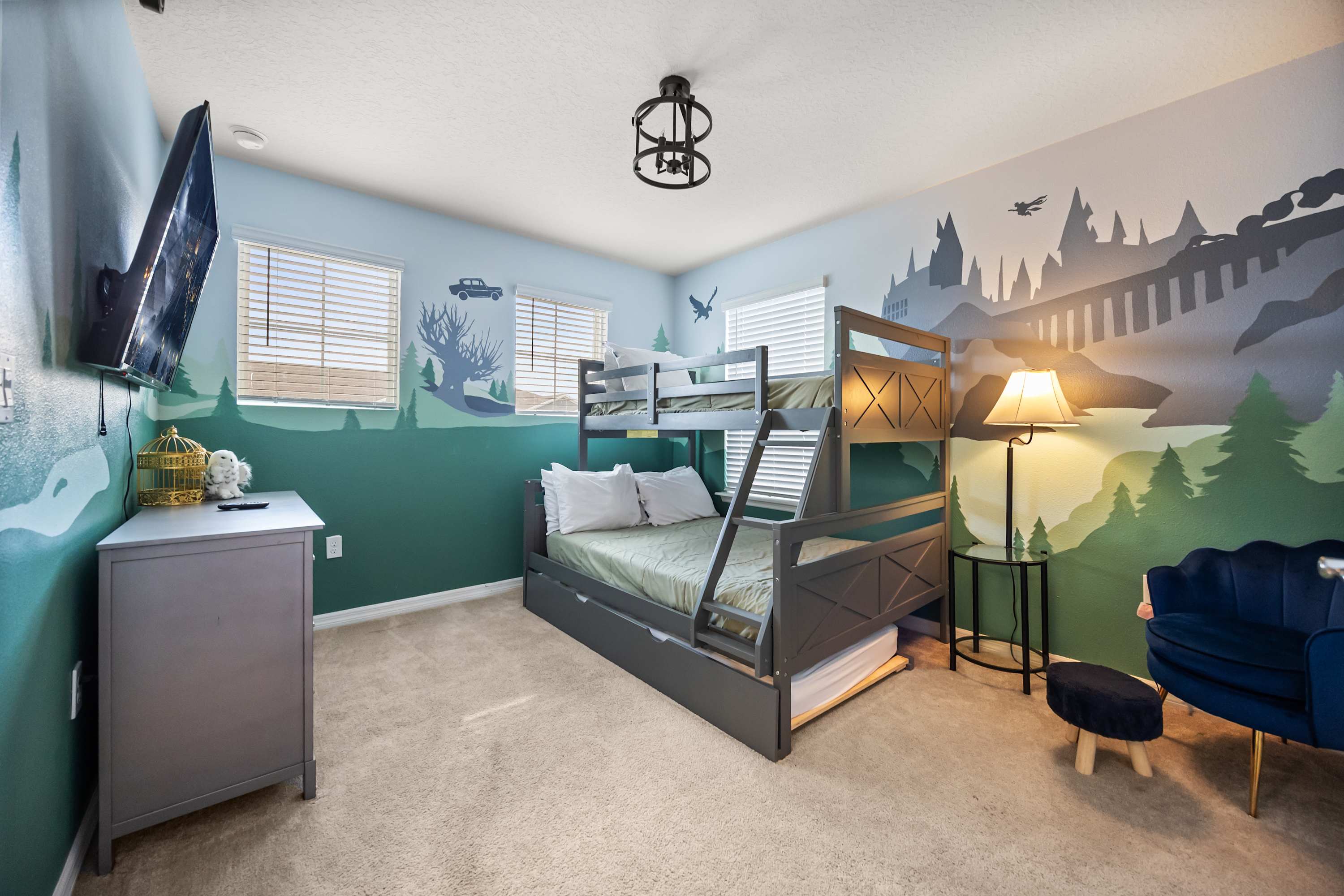 Enchanting themed bedroom with bunk bed and magical mural—perfect for kids and families seeking adventure.