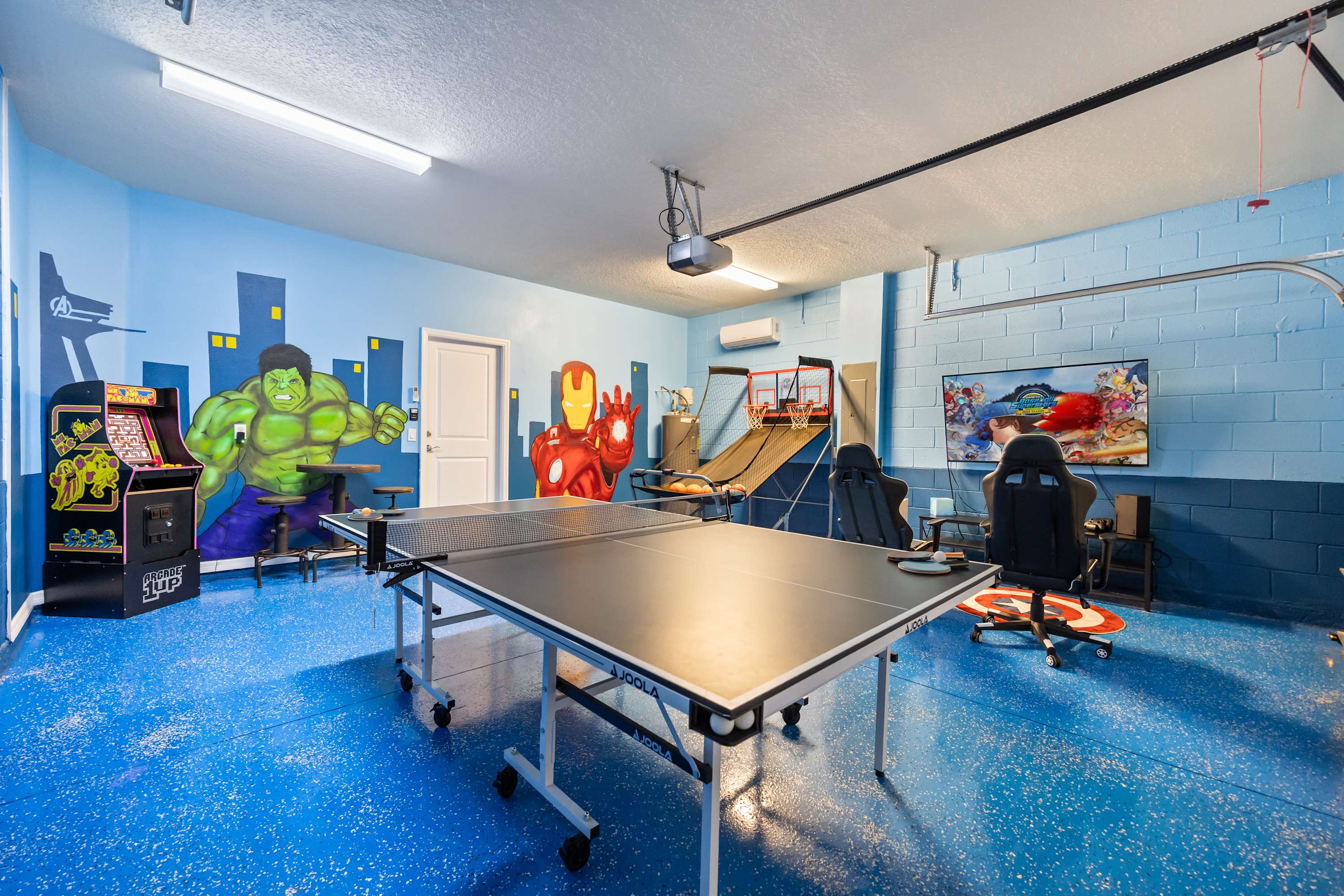 Unleash your inner hero in this vibrant game room with ping pong, arcade games, and more. Perfect for family fun!