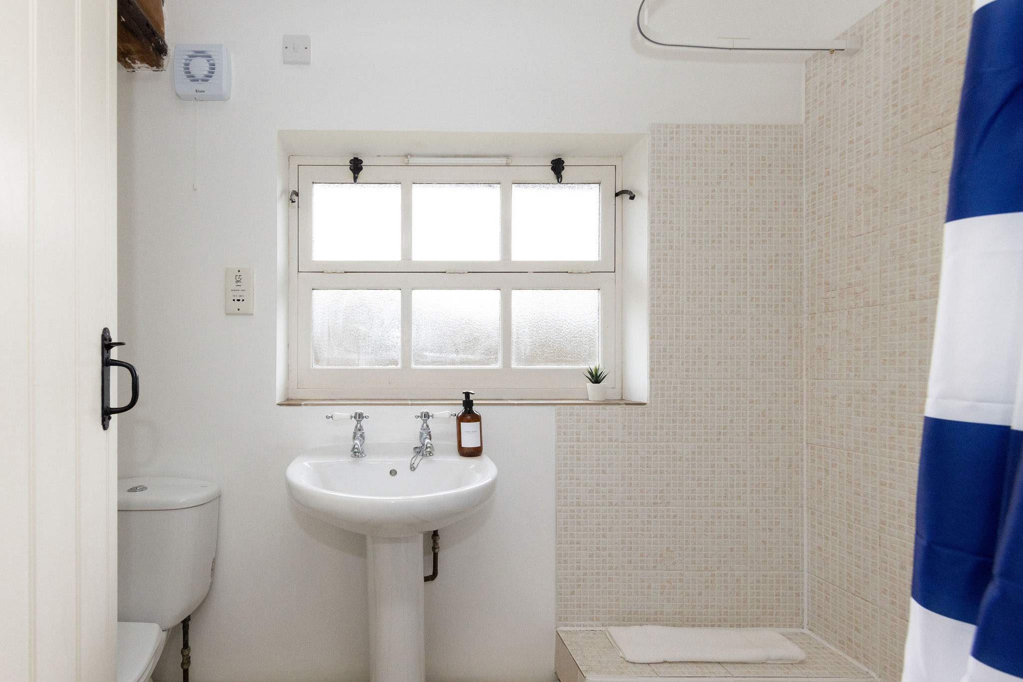 The family bathroom is on the ground floor and has a shower, WC and sink.