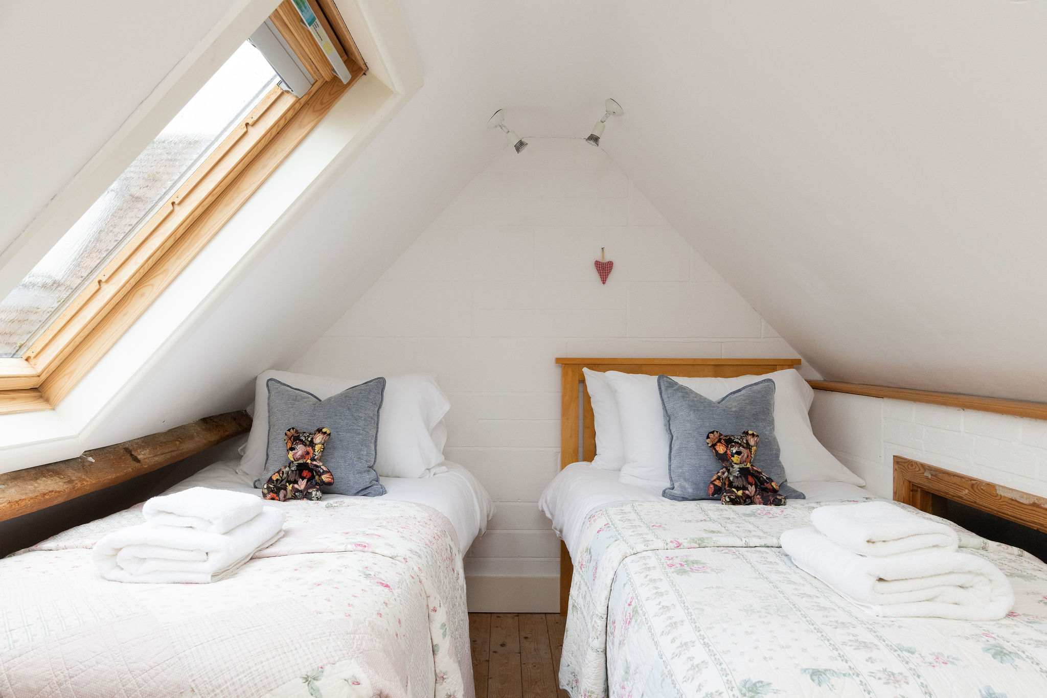 The upstairs mezzanine floor is home to the third bedroom, which features a single bed and pull out trundle.