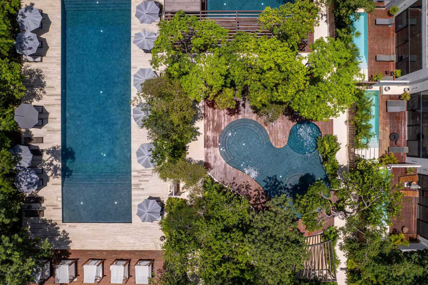 Drone view of the three gorgeous shared pools at the Karanda complex, enjoyed together with other guests.