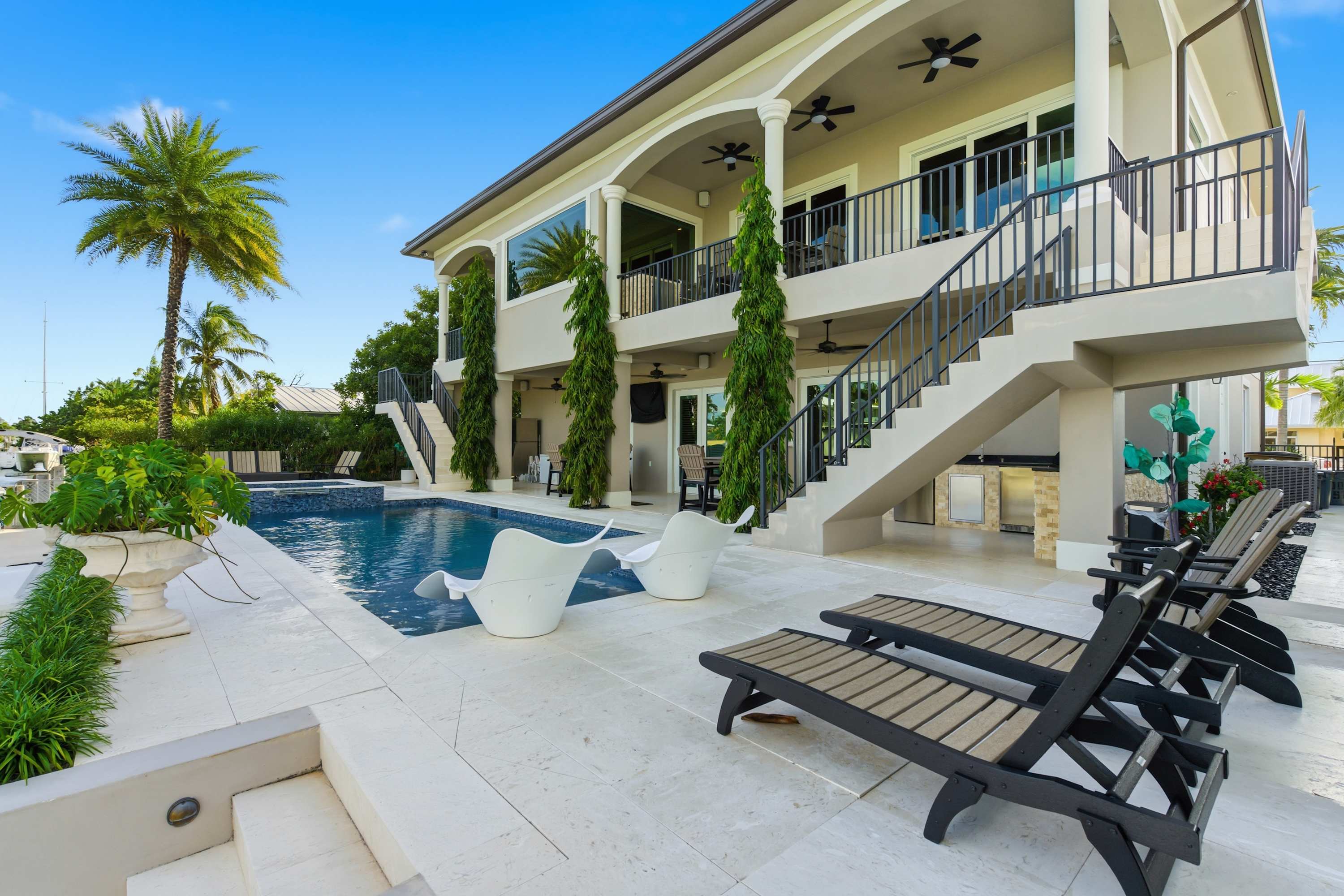 Southern Palms -Luxury 5 Bd/ 6 Bath waterfront home on wide canal in Key Colony Beach, private pool and hot tub, 32' Dockage, Minutes to Atlantic Ocean, Easy Access.Newer Construction. Ice Maker, All Bedrooms with Ensuite Bathrooms, Stunning water views — Marathon, FL — vacation rental