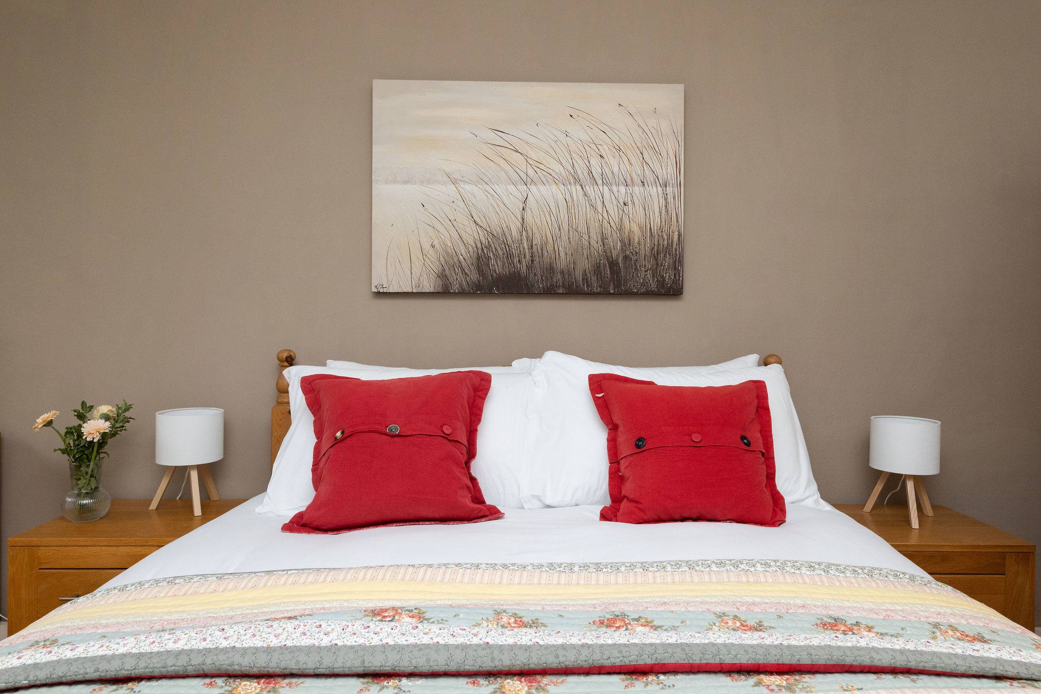 Sink into the comfy king bed with fresh white linens for a restful night's sleep.