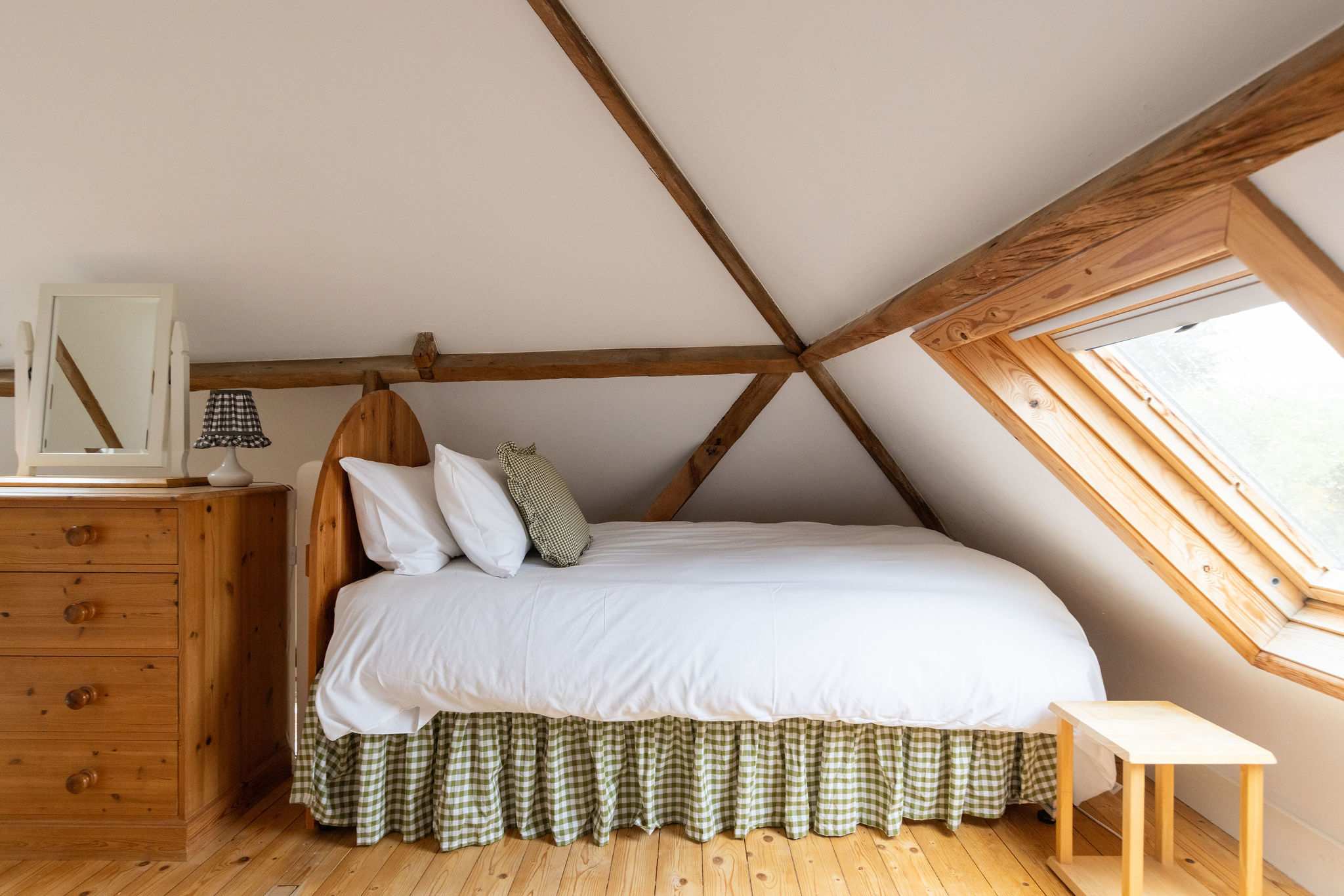 Cosy single bed in the mezzanine twin room, with skylight views of the surrounding countryside.