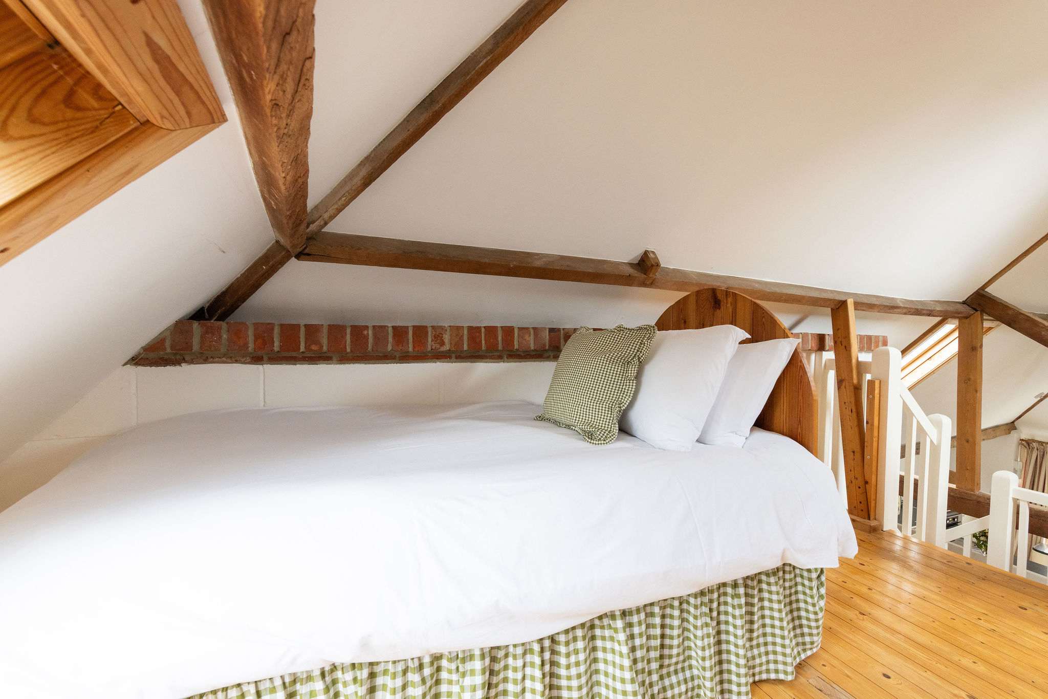 Twin bedroom with comfy beds and warm wooden tones, a peaceful upstairs retreat.