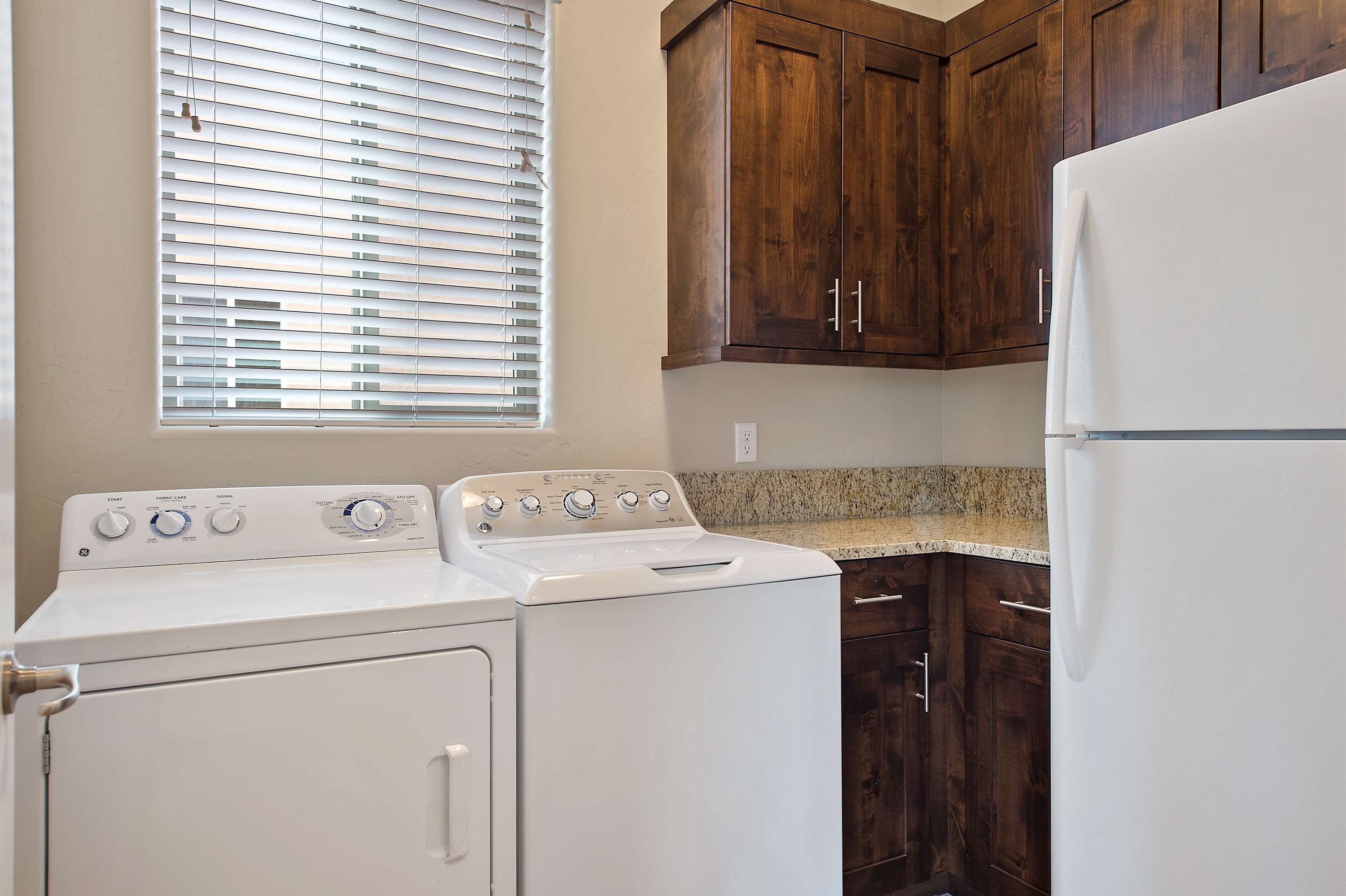 Laundry room with a convenient 2nd fridge
