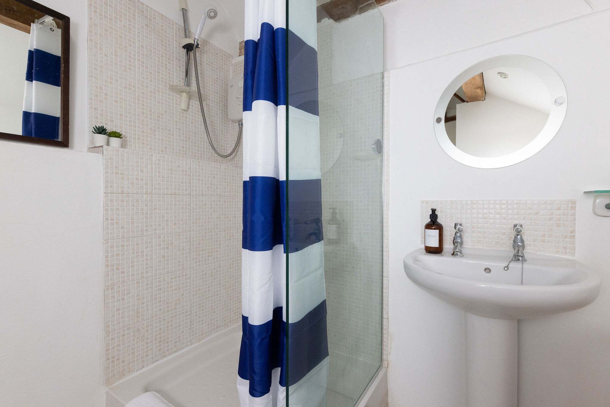 The shower ensuite to Wren Barn's master bedroom is spacious and bright.