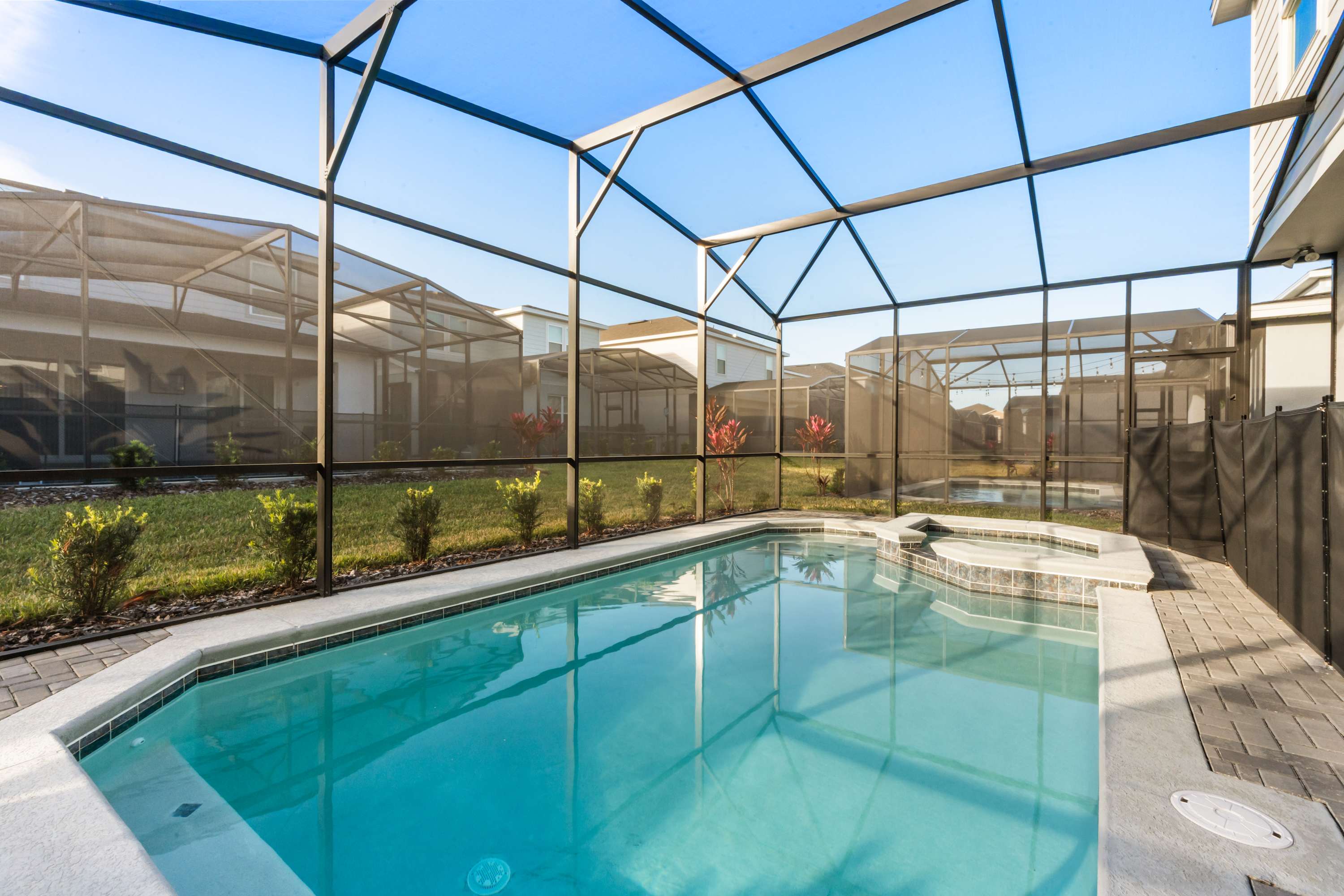 Dive into relaxation in your private screened pool and hot tub, a serene oasis for unwinding after a day of adventure.