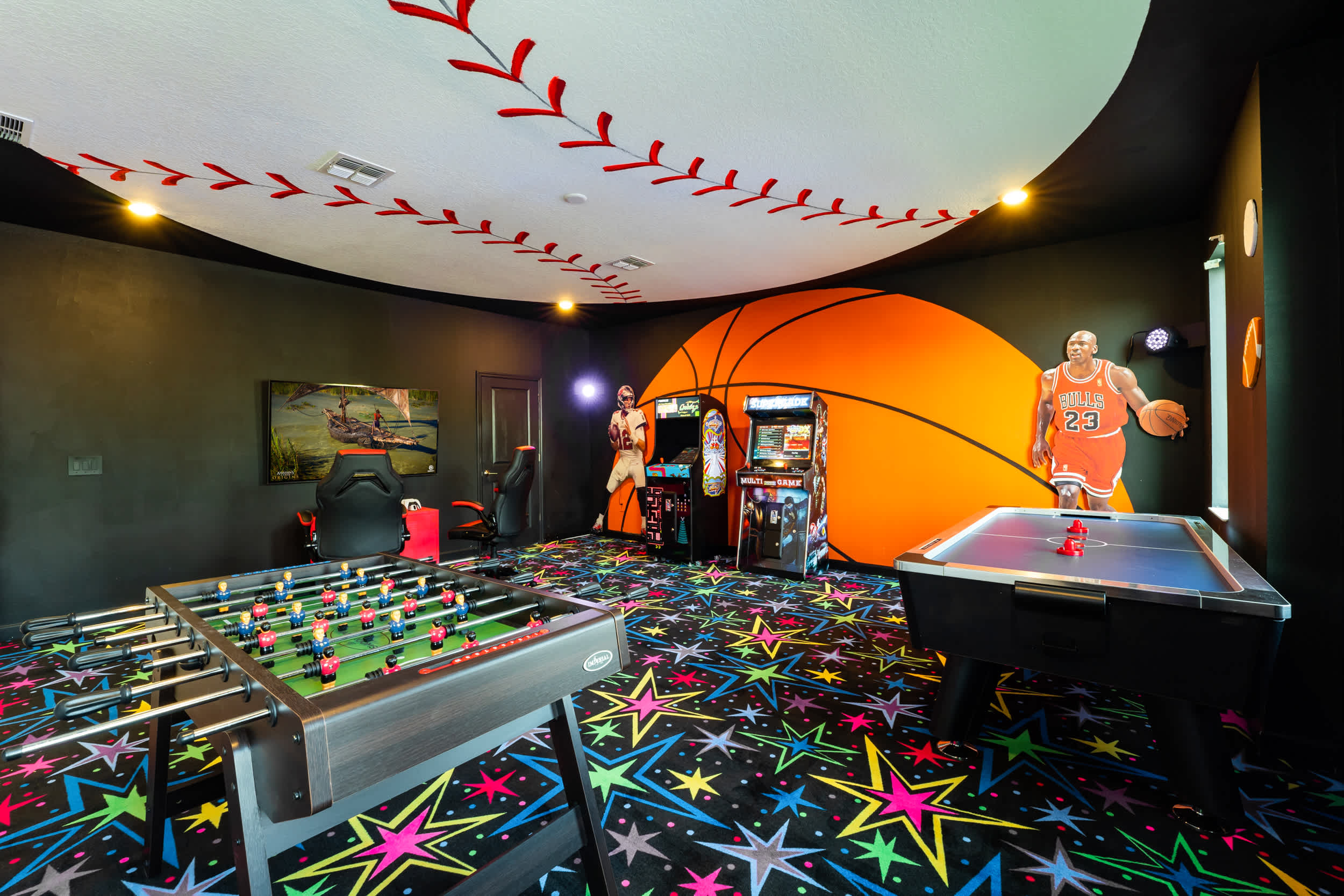 Experience endless fun in this vibrant sports-themed game room with arcade games, foosball, and air hockey.