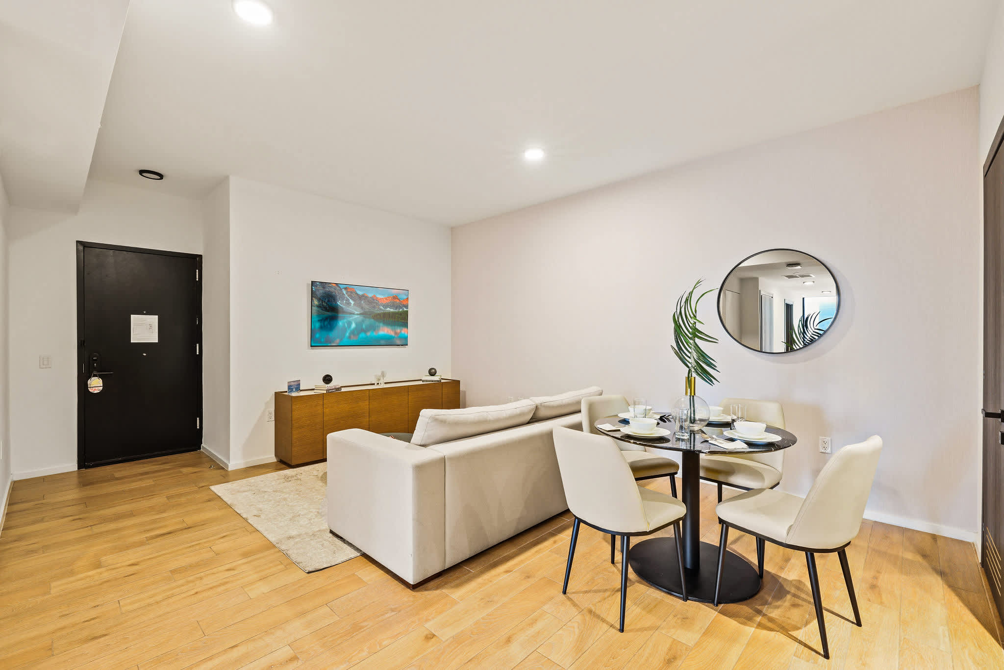 Stylish living and dining space with modern decor, perfect for relaxing or entertaining.