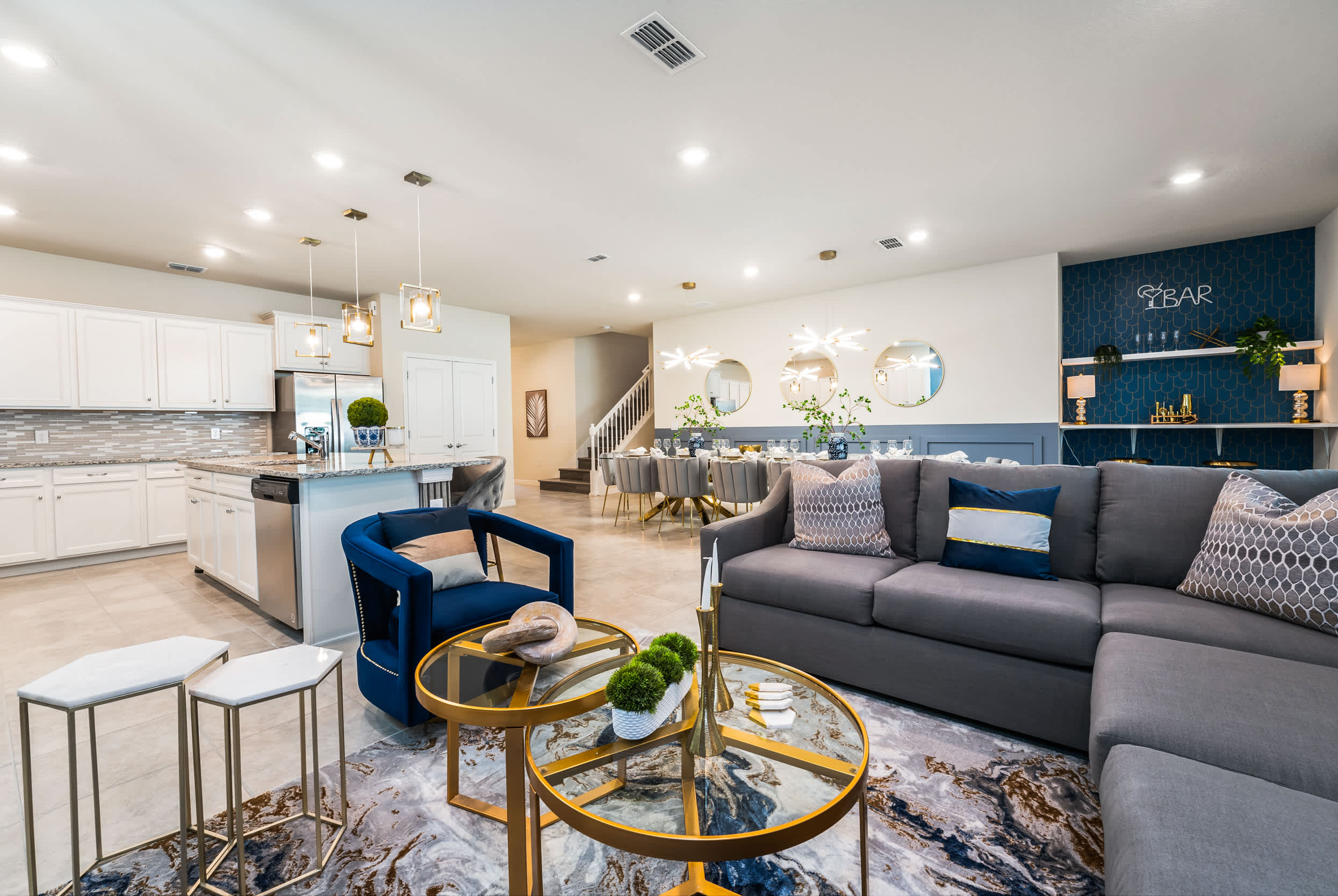 Experience luxury in this expansive living space with a modern kitchen and elegant dining area, perfect for entertaining large groups.