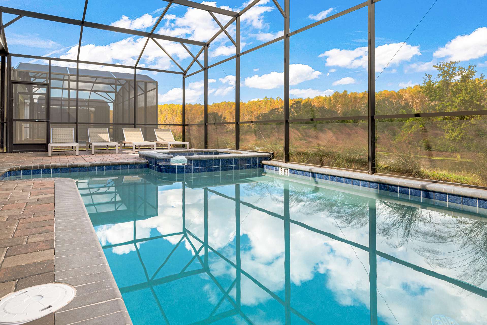 Relax in your private screened pool with serene views and a hot tub, perfect for unwinding after a day of adventure.
