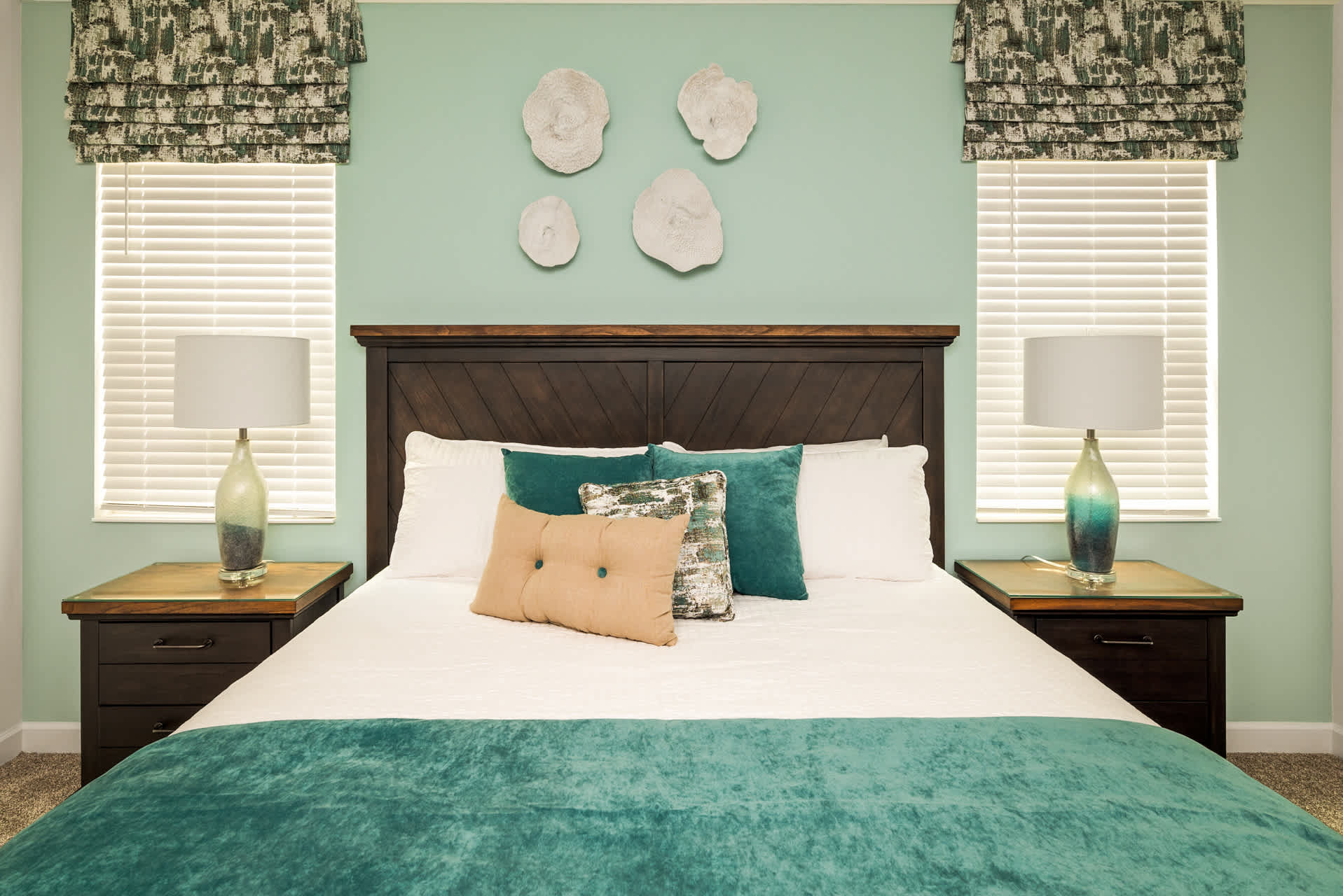 Relax in this serene bedroom with plush bedding and stylish decor, perfect for unwinding after a day of exploring.